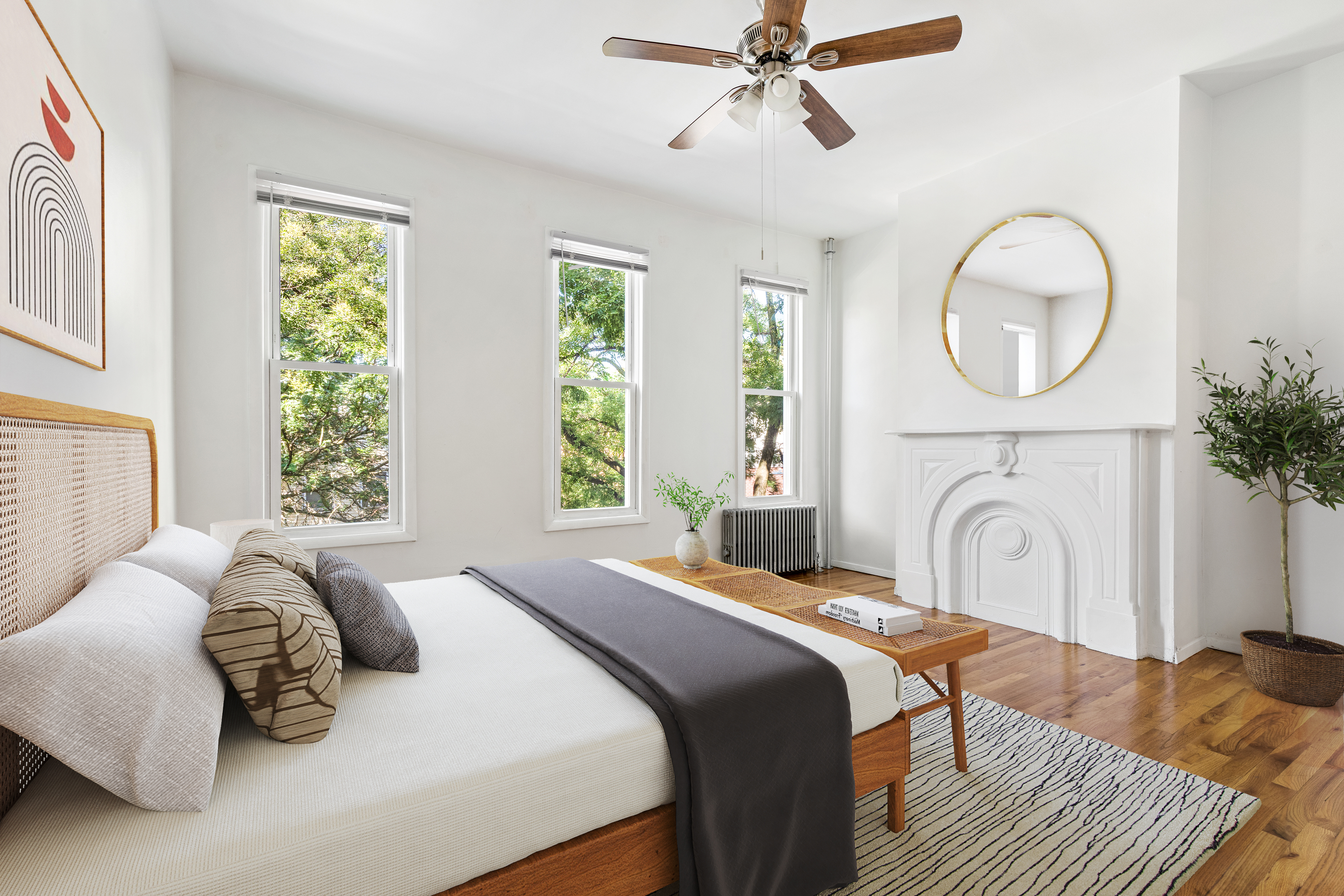 a bedroom with a bed mirror and a window
