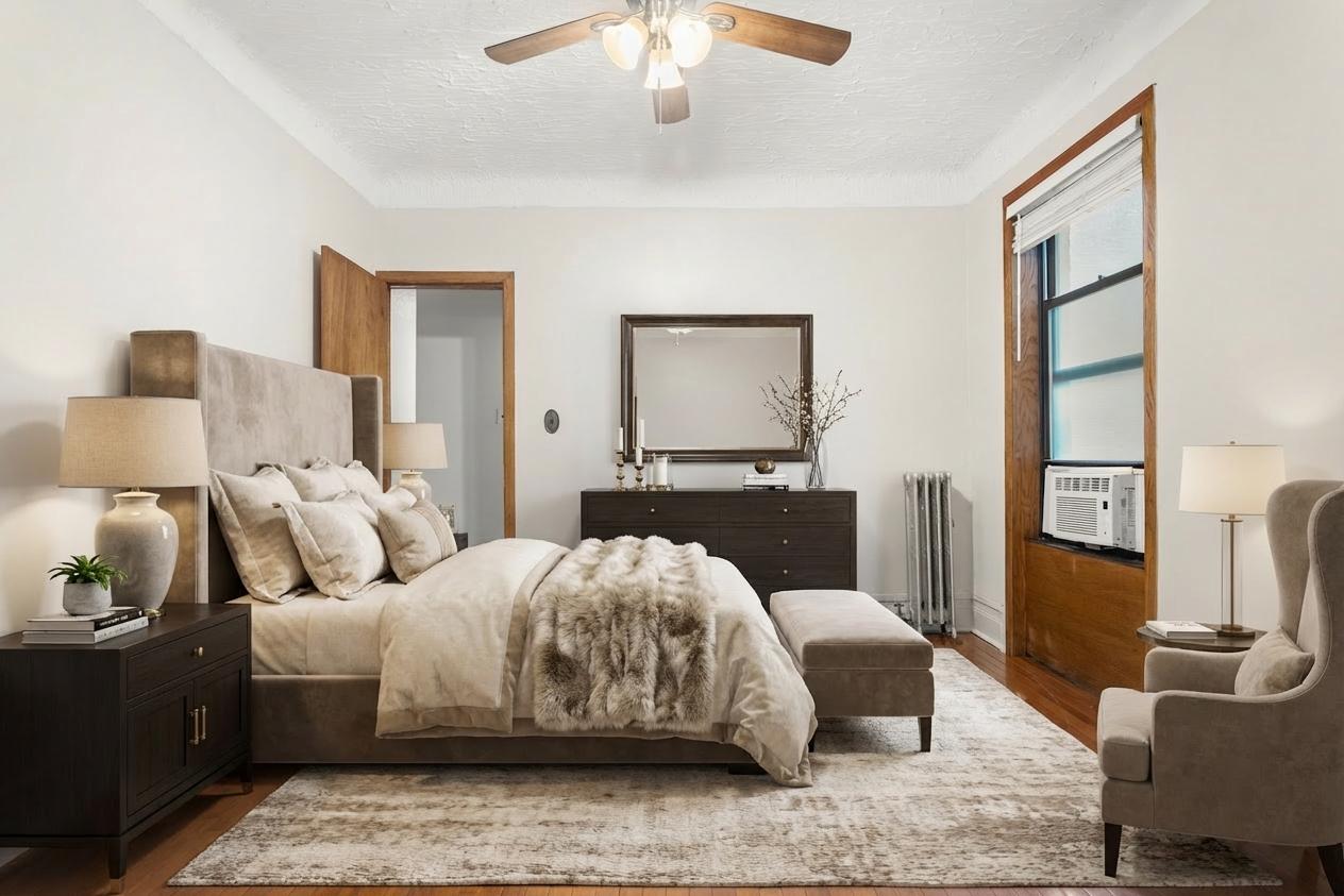 527 West 143rd Street, Unit 31 Manhattan, NY 10031 - Photo 15 of 29 a bedroom with a bed and wooden floor