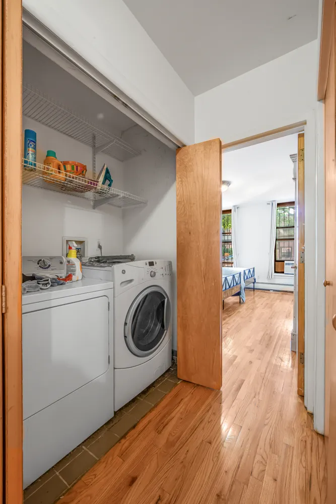 a view of a storage & utility room with washer and dryer