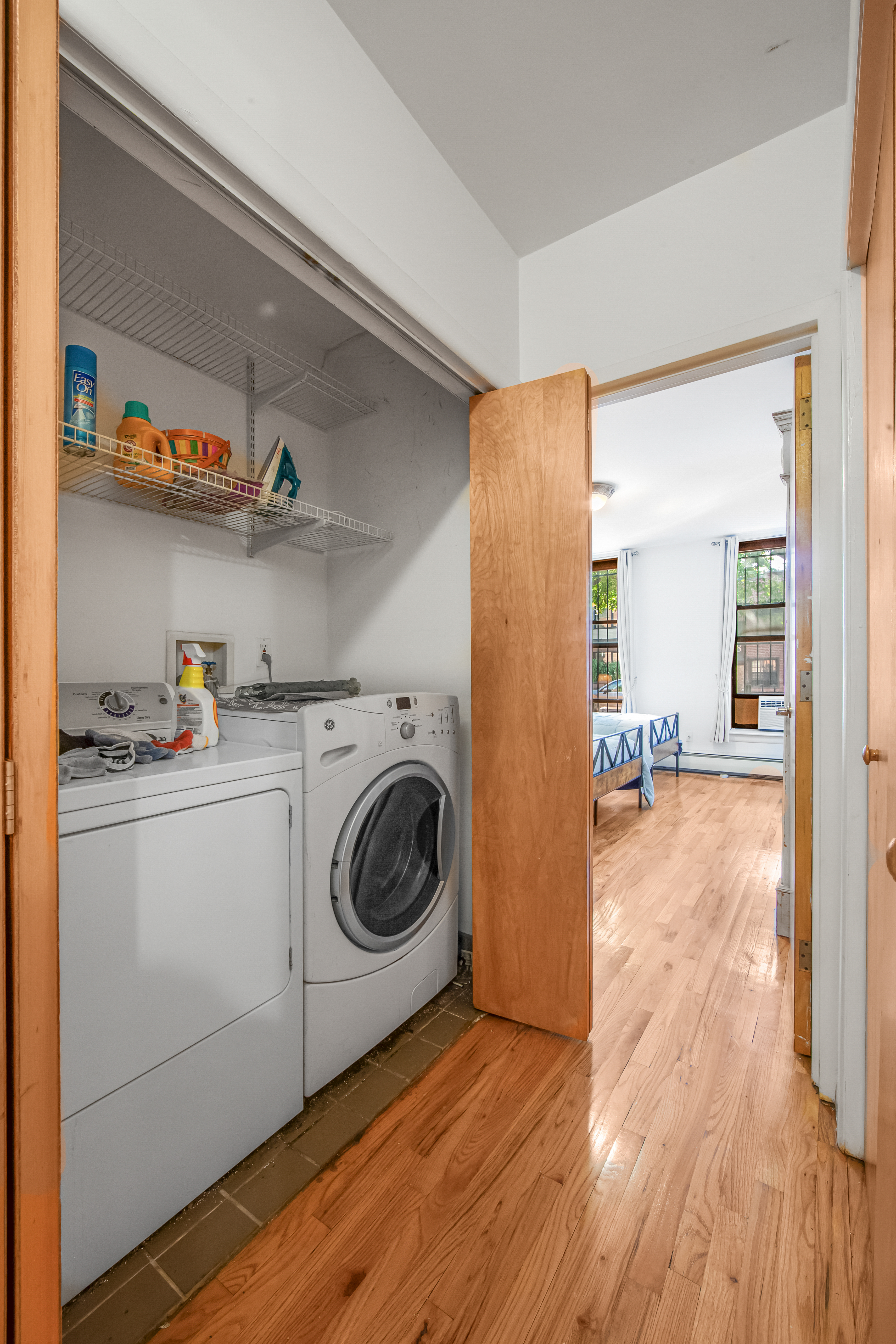 129 Waverly Avenue, Unit 1 Brooklyn, NY 11205 - Photo 9 of 13 a view of a storage & utility room with washer and dryer