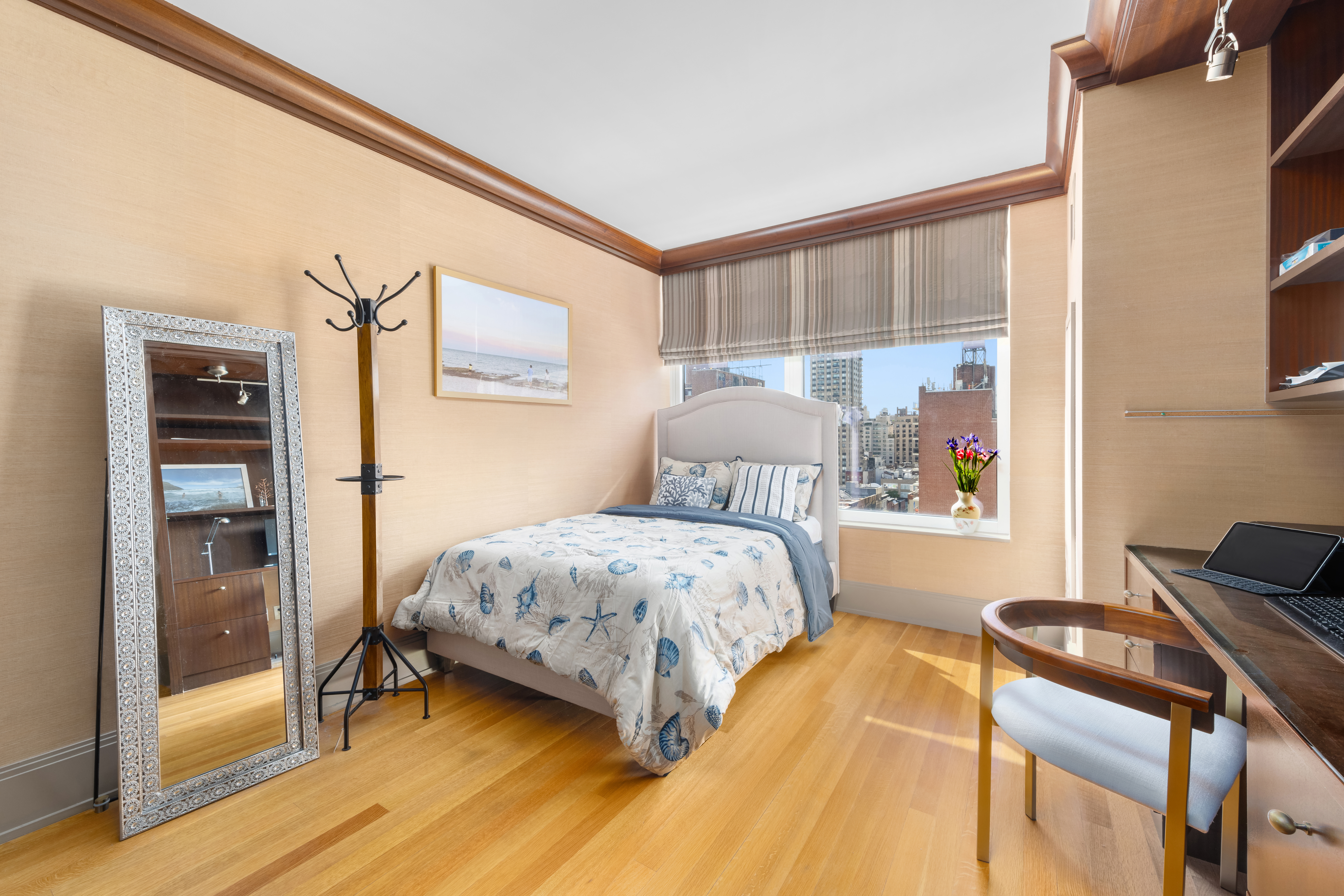 305 East 85th Street, Unit 14D Manhattan, NY 10028 - Photo 9 of 11 a bedroom with a bed and wooden floor