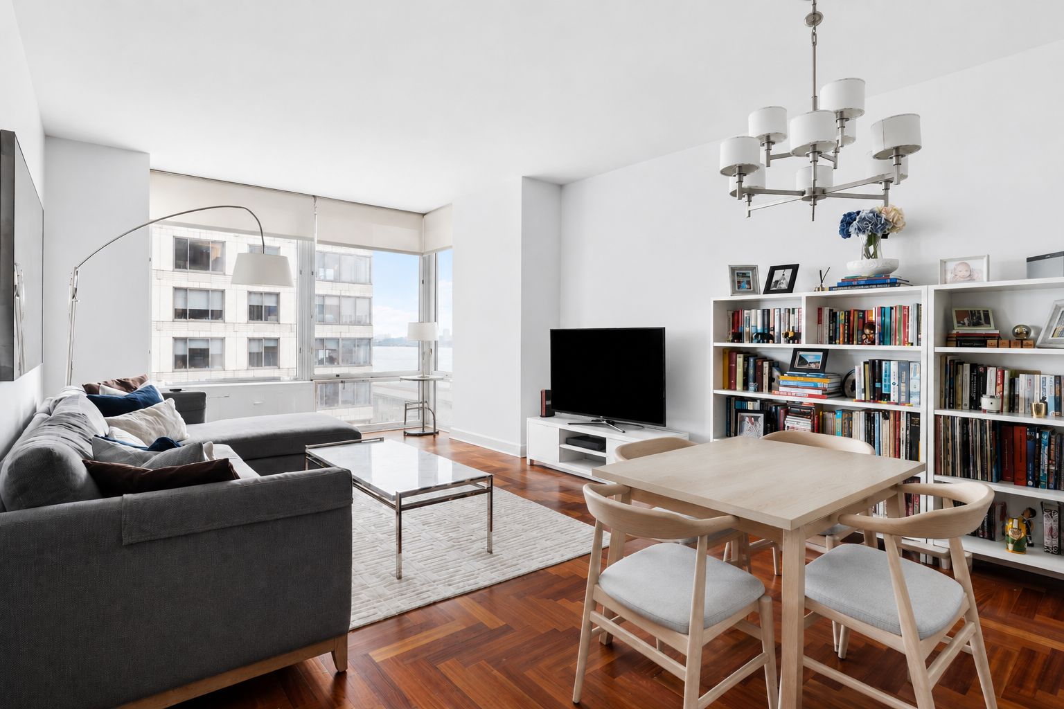 220 Riverside Boulevard, Unit 7G Manhattan, NY 10069 - Photo 1 of 11 a view of a livingroom with furniture and a bookshelf