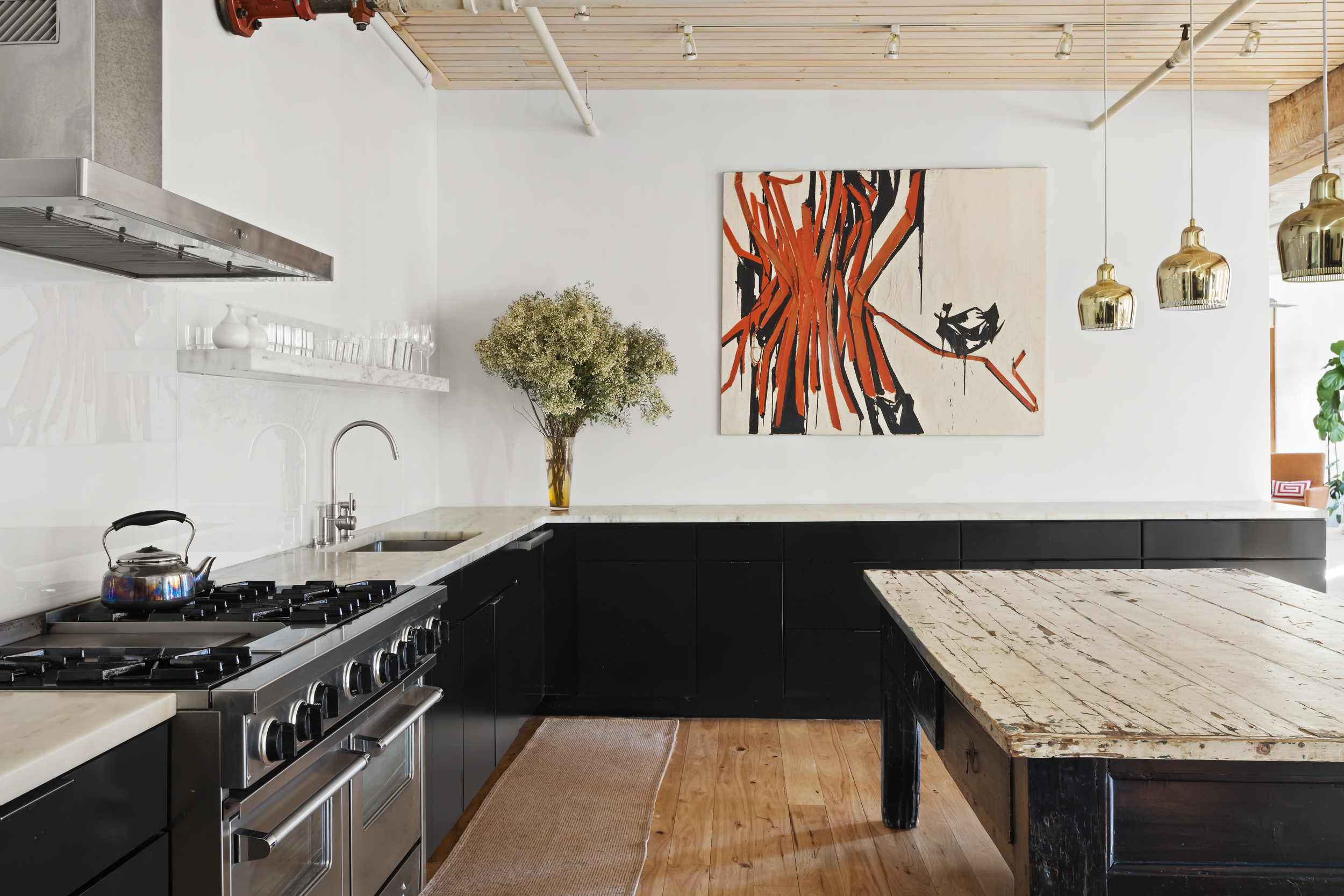 463 Greenwich Street Manhattan, NY 10013 - Photo 7 of 24 a kitchen with a sink and a stove