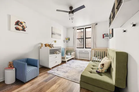 a living room with furniture and white walls