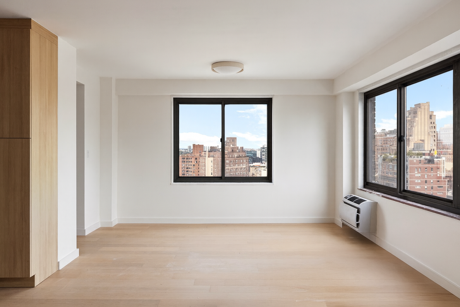 175 West 12th Street, Unit 20E Manhattan, NY 10011 - Photo 3 of 12 a view of an empty room with a window
