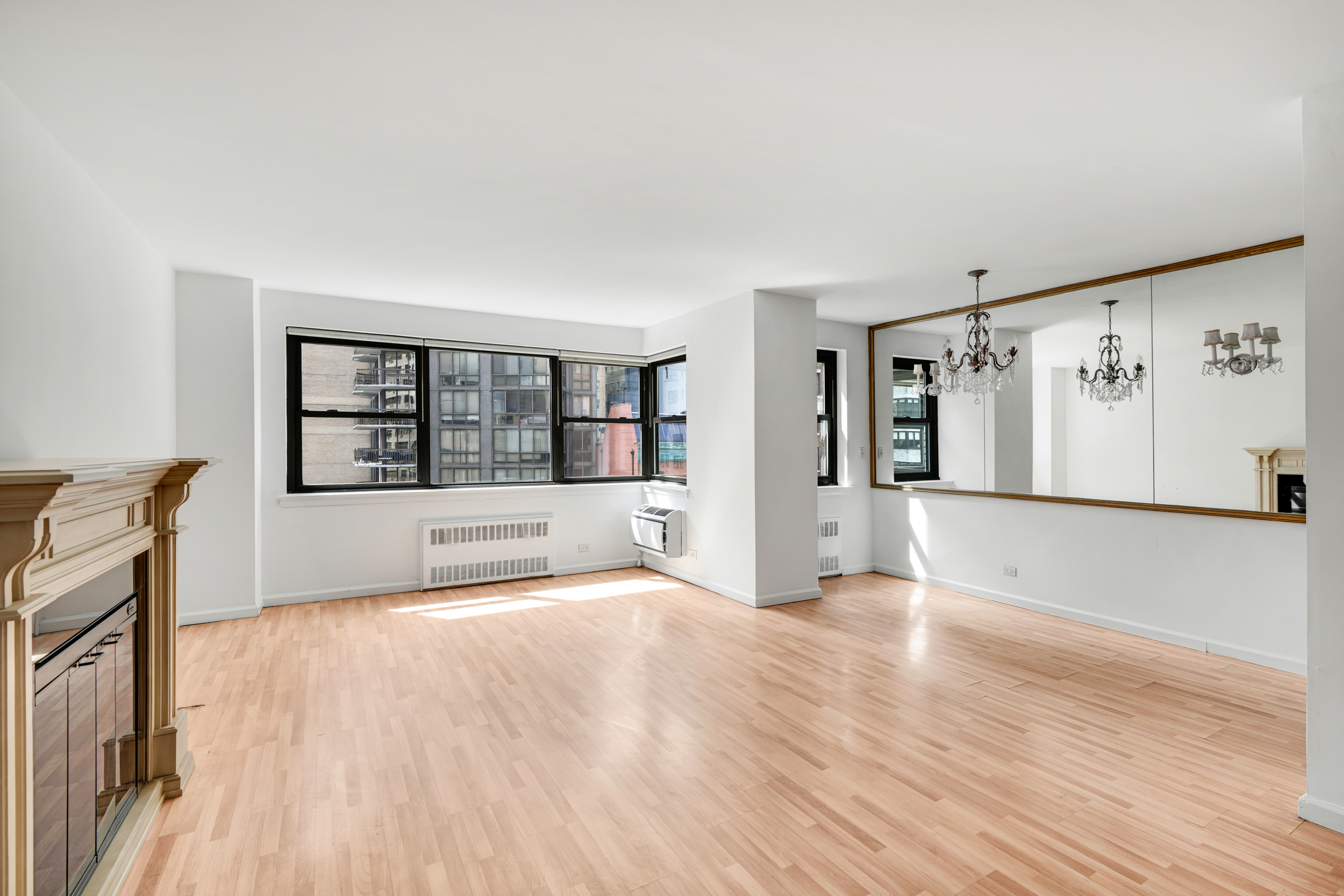 357 East 57th Street, Unit 5D Manhattan, NY 10022 - Photo 15 of 23 a view of an empty room with a window and wooden floor