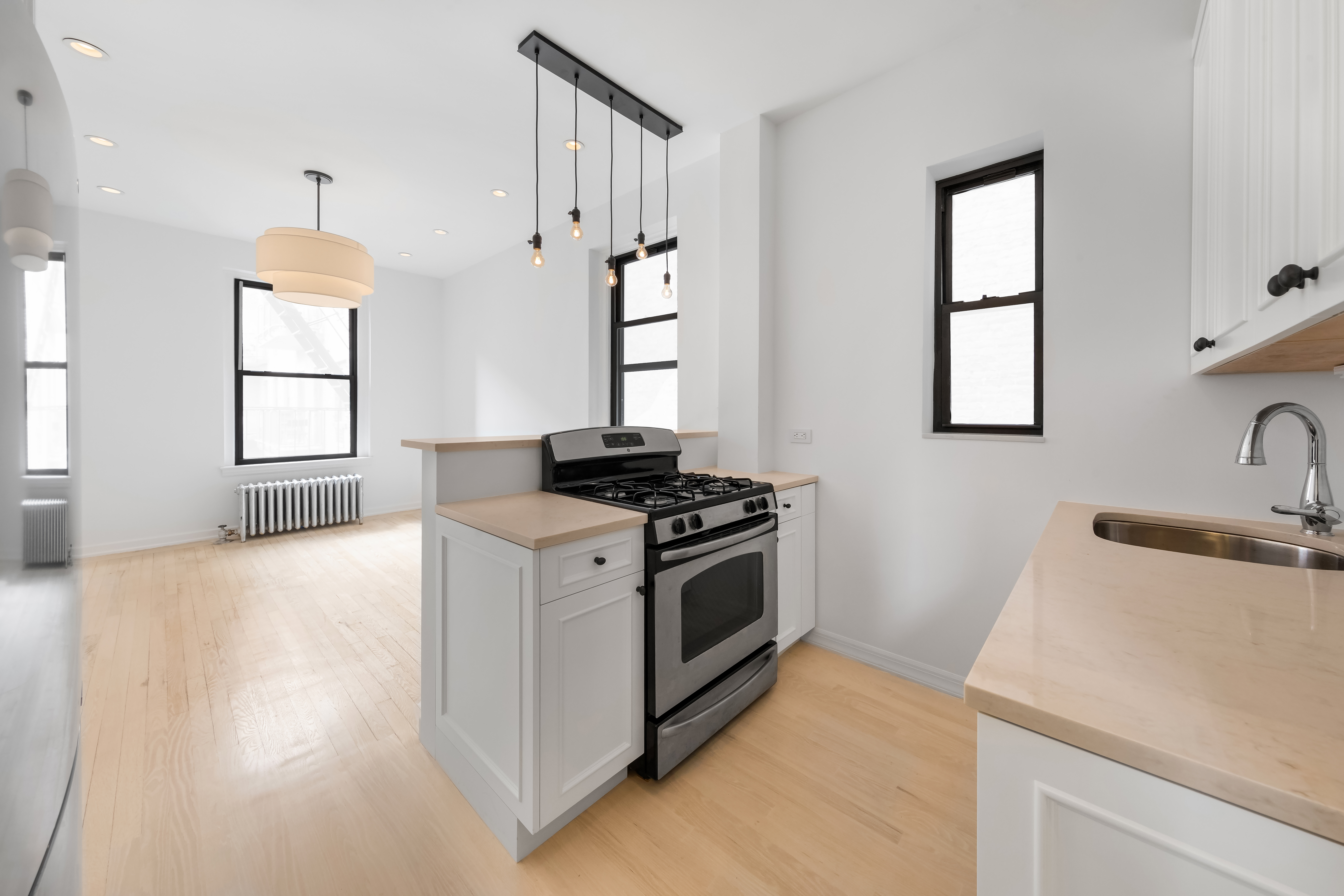a kitchen with a stove and a sink