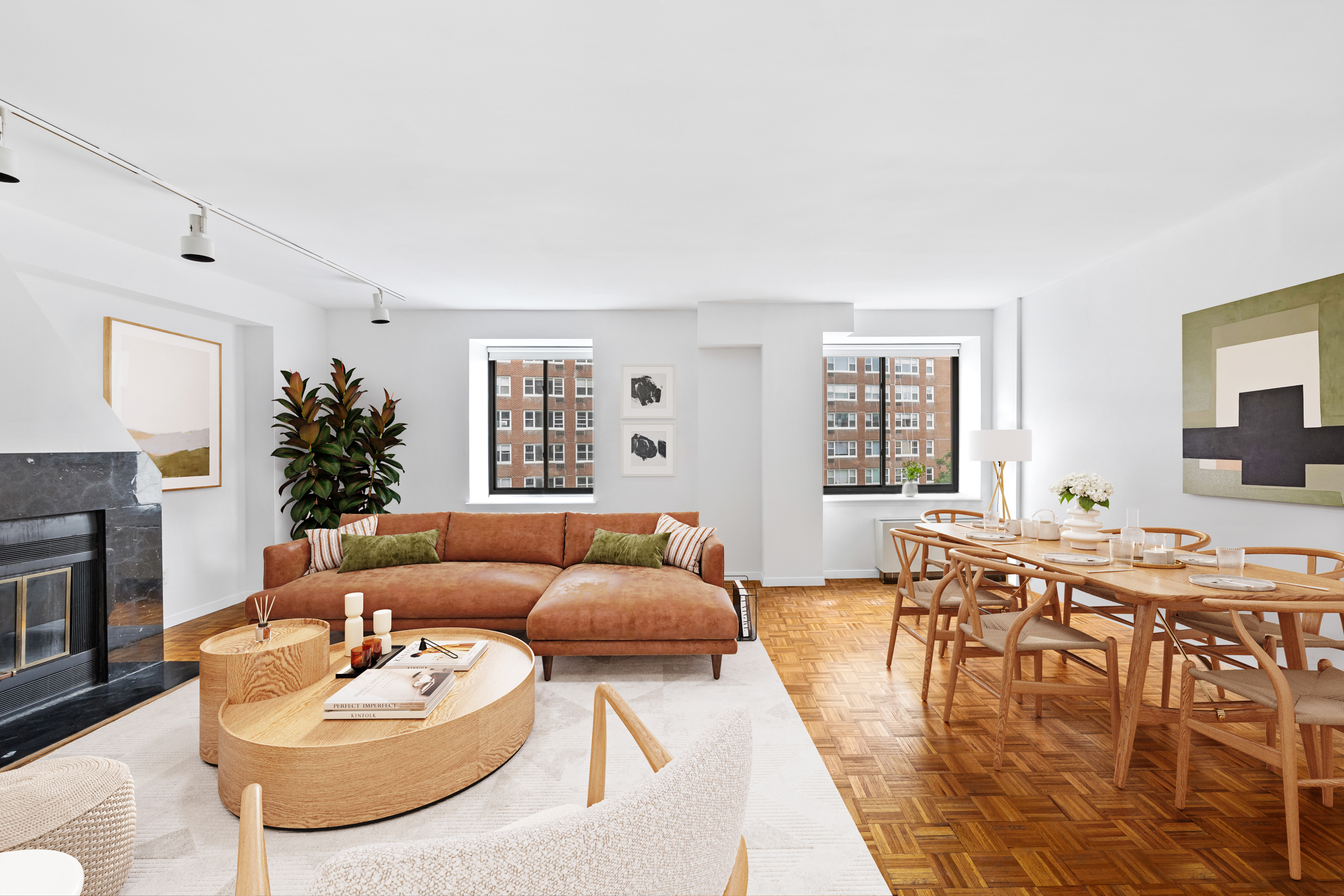 196 6th Avenue, Unit 5A Manhattan, NY 10013 - Photo 3 of 12 a living room with furniture a fireplace and a large window