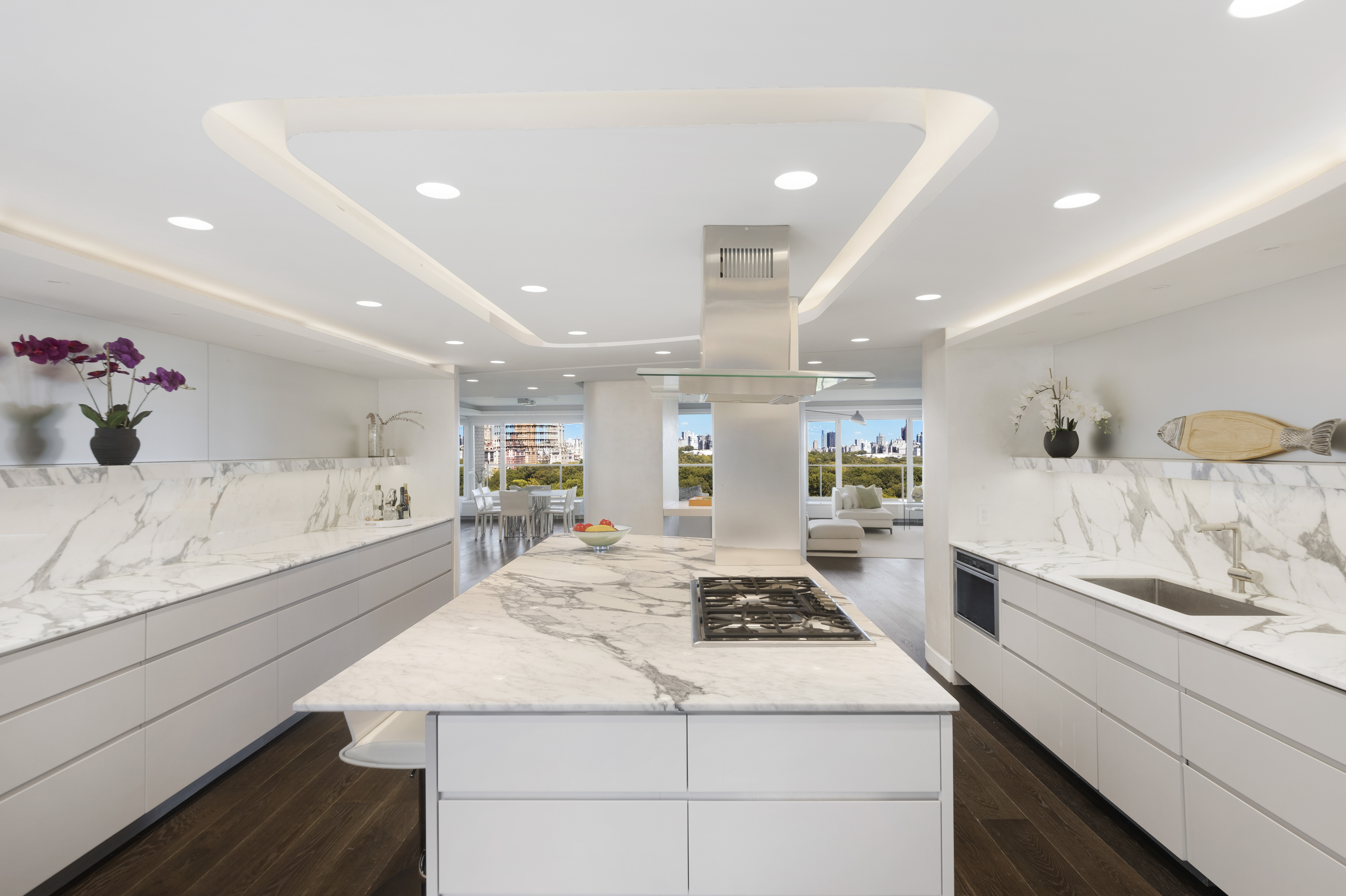 200 Central Park South, Unit 20DEF Manhattan, NY 10019 - Photo 8 of 16 a large white kitchen with a stove a sink a refrigerator and cabinets