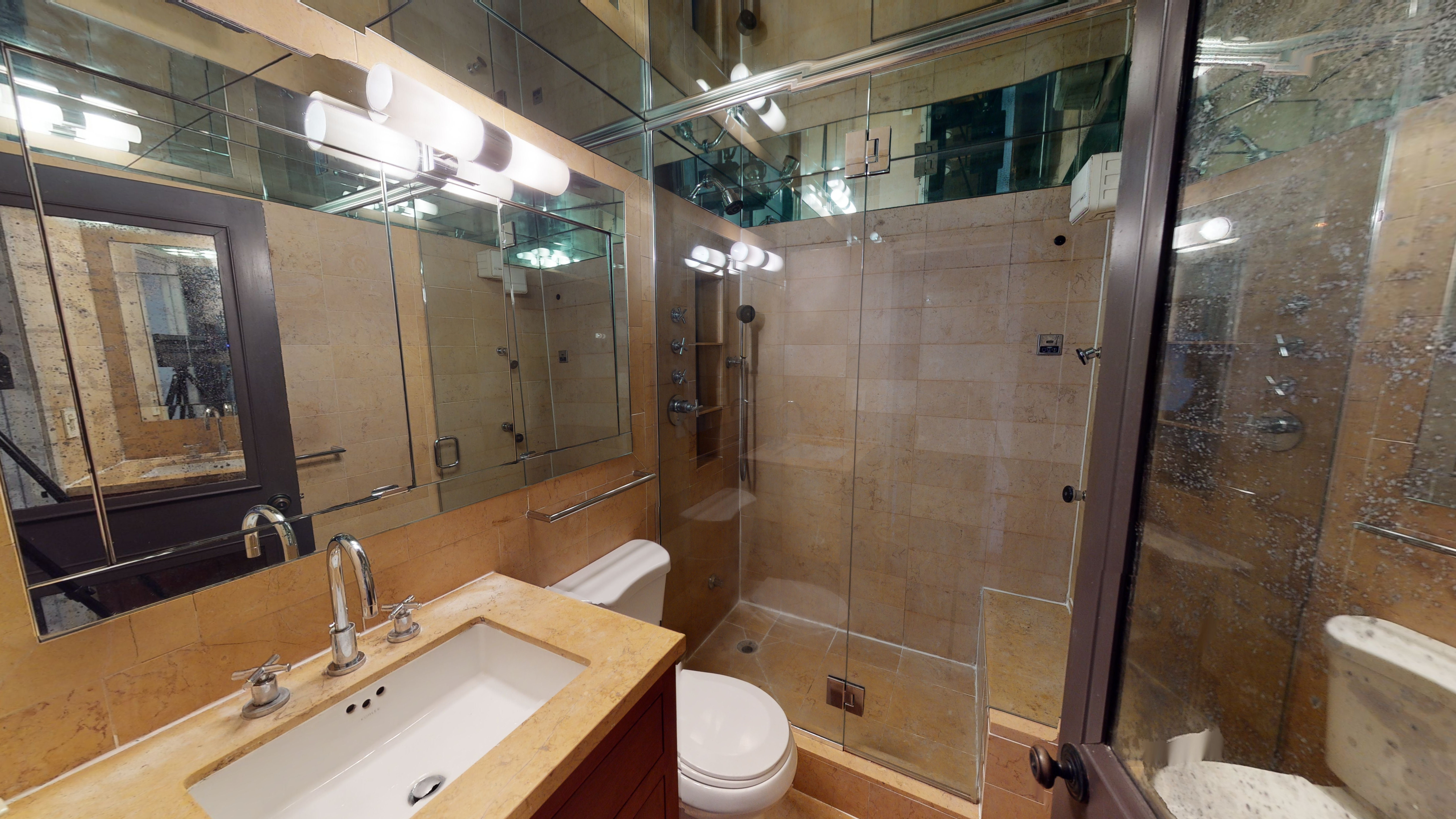 50 Lexington Avenue, Unit 4H Manhattan, NY 10010 - Photo 7 of 13 a bathroom with a sink a toilet and shower