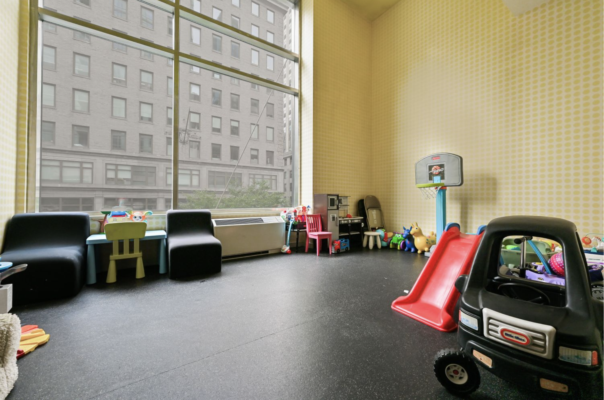 325 5th Avenue, Unit 16C Manhattan, NY 10016 - Photo 16 of 25 a living room with furniture a rug and a window