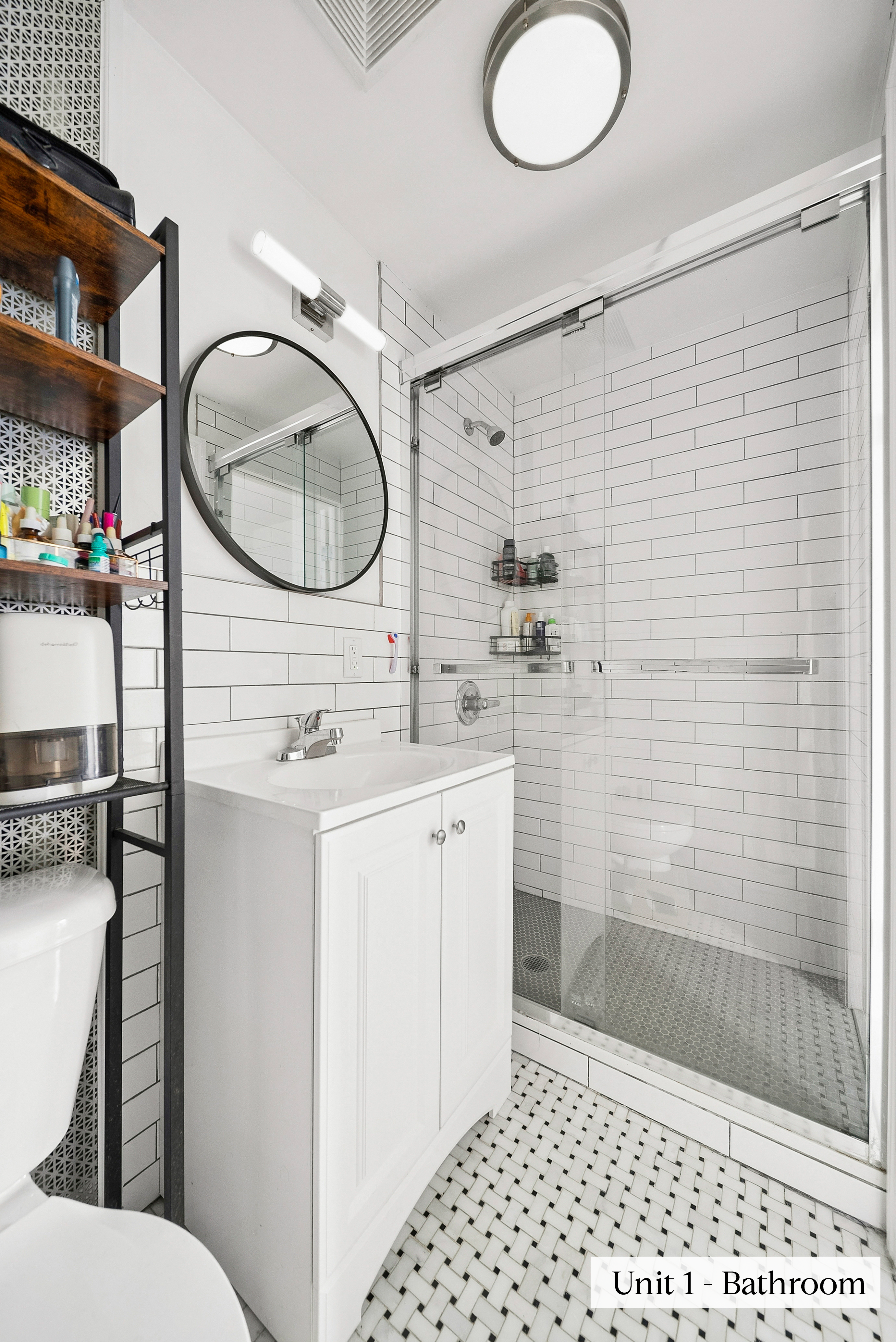 460 9th Street Brooklyn, NY 11215 - Photo 11 of 24 a bathroom with a sink a toilet and shower
