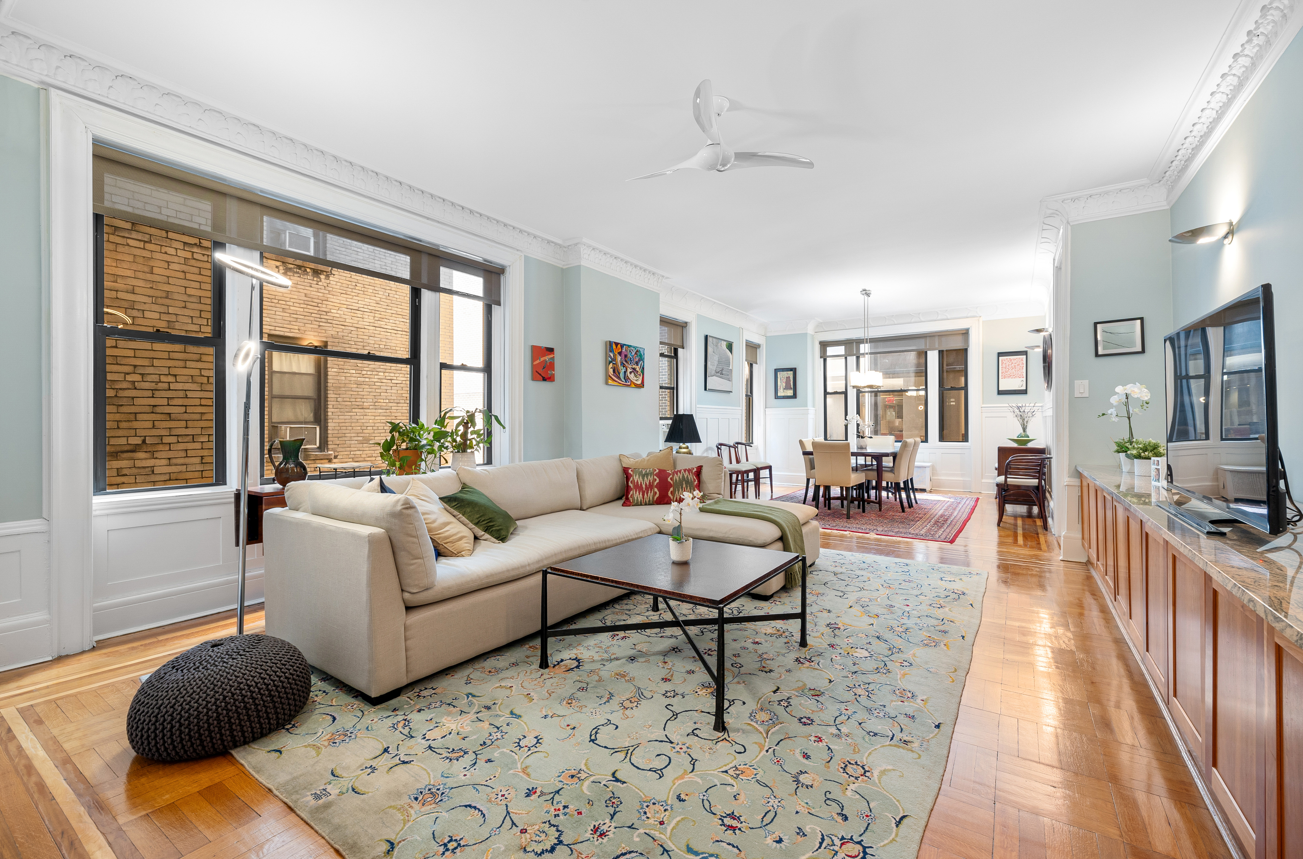200 West 54th Street, Unit 9G Manhattan, NY 10019 - Photo 3 of 17 a living room with furniture and a table