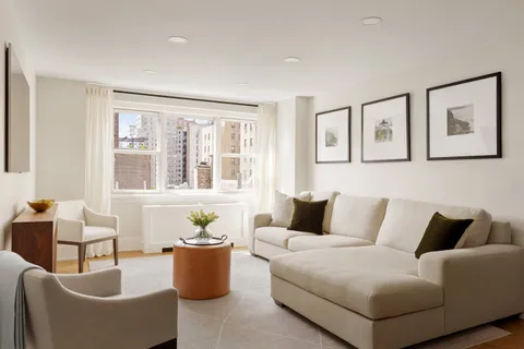 a living room with furniture and windows