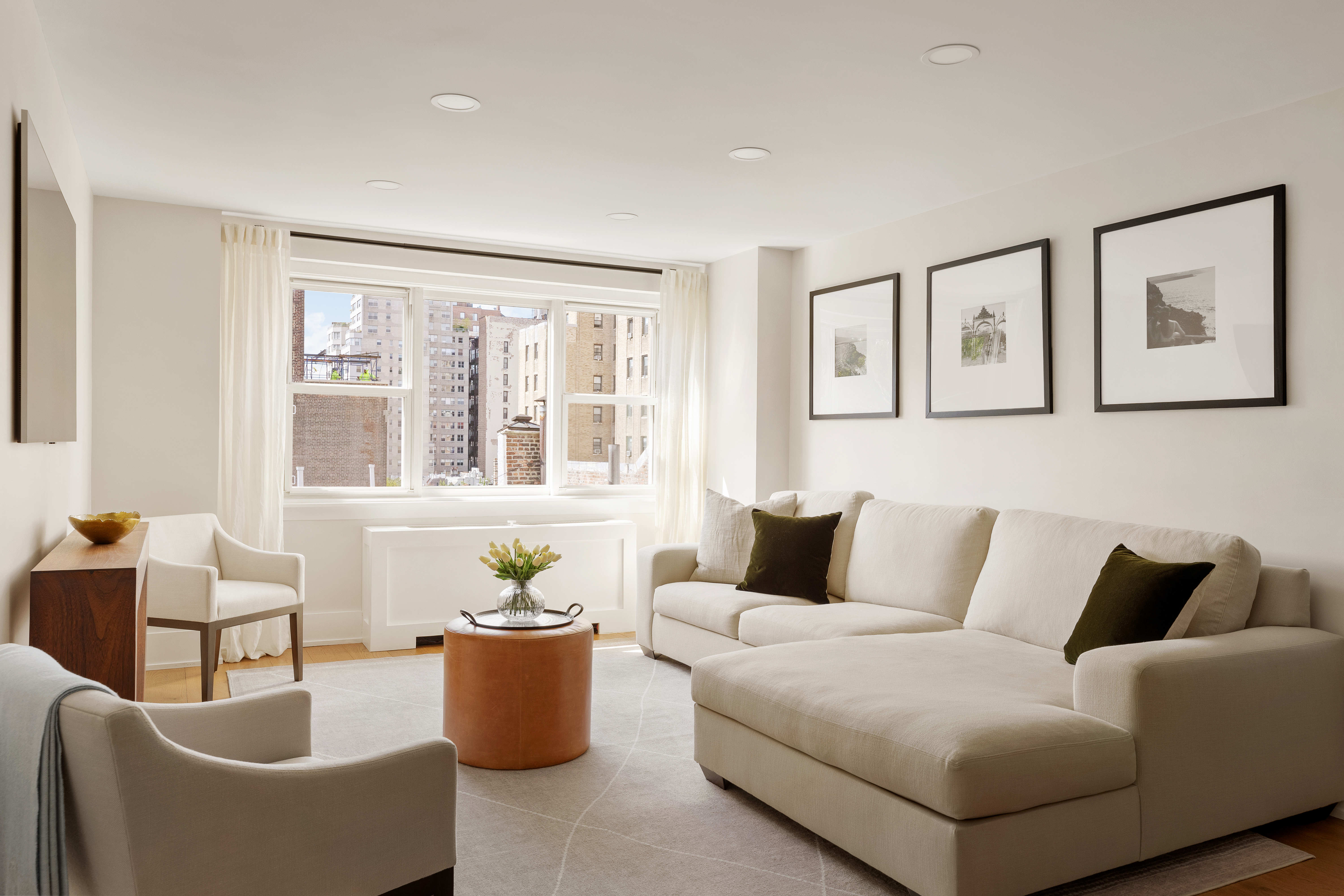 a living room with furniture and windows