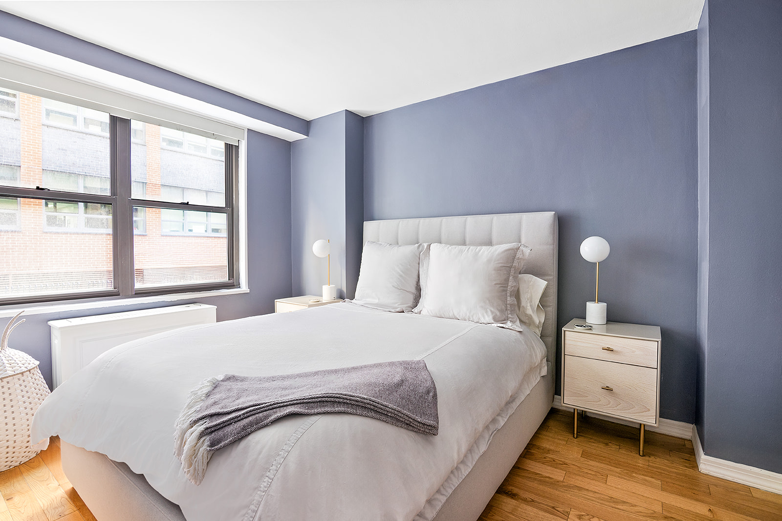 7 East 14th Street, Unit 429 Manhattan, NY 10003 - Photo 4 of 6 a bedroom with a bed and a large window