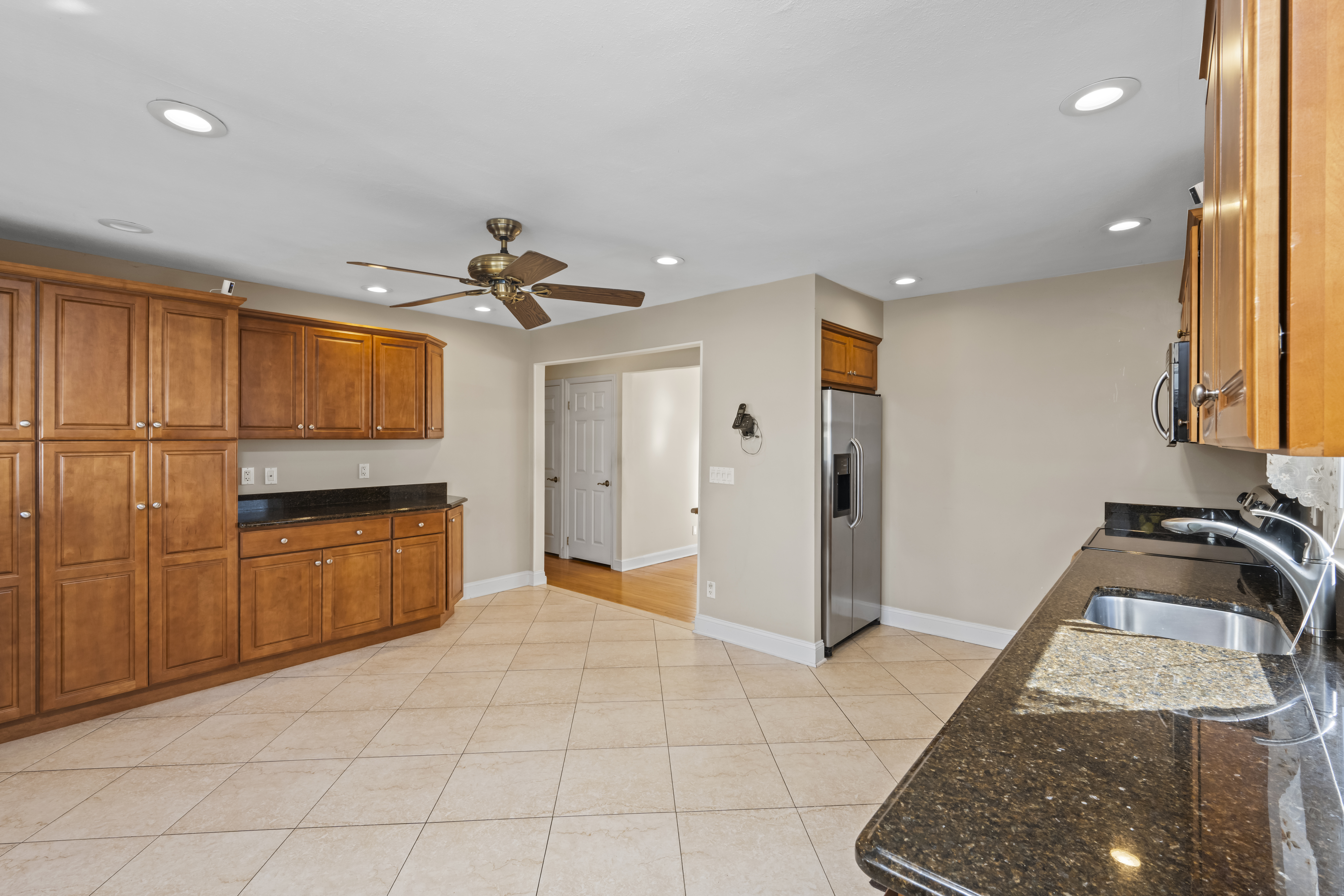 522 Stewart Avenue Staten Island, NY 10314 - Photo 10 of 33 a view of a kitchen with a sink and a refrigerator