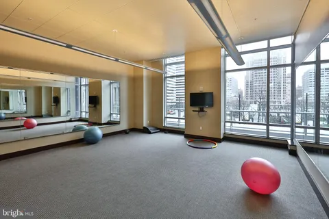 a view of a livingroom with furniture and a large window