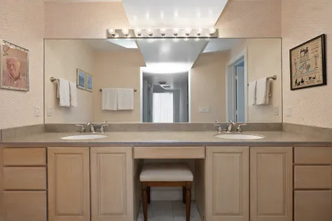 a bath tub sitting next to a white sink