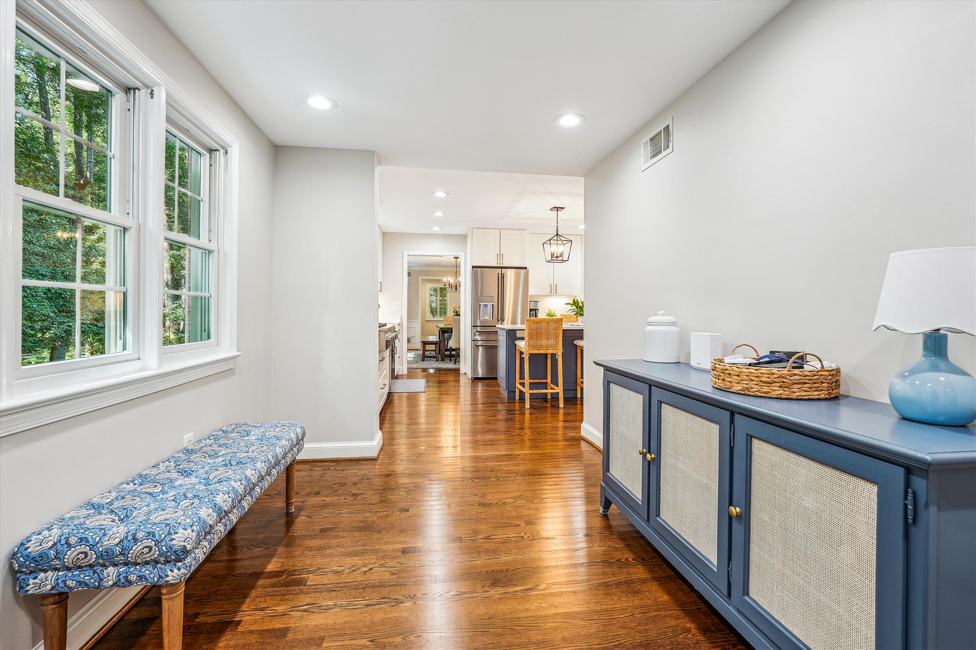 9904 Carter Road Bethesda, MD 20817 - Photo 16 of 41 a hallway with dining table and chairs