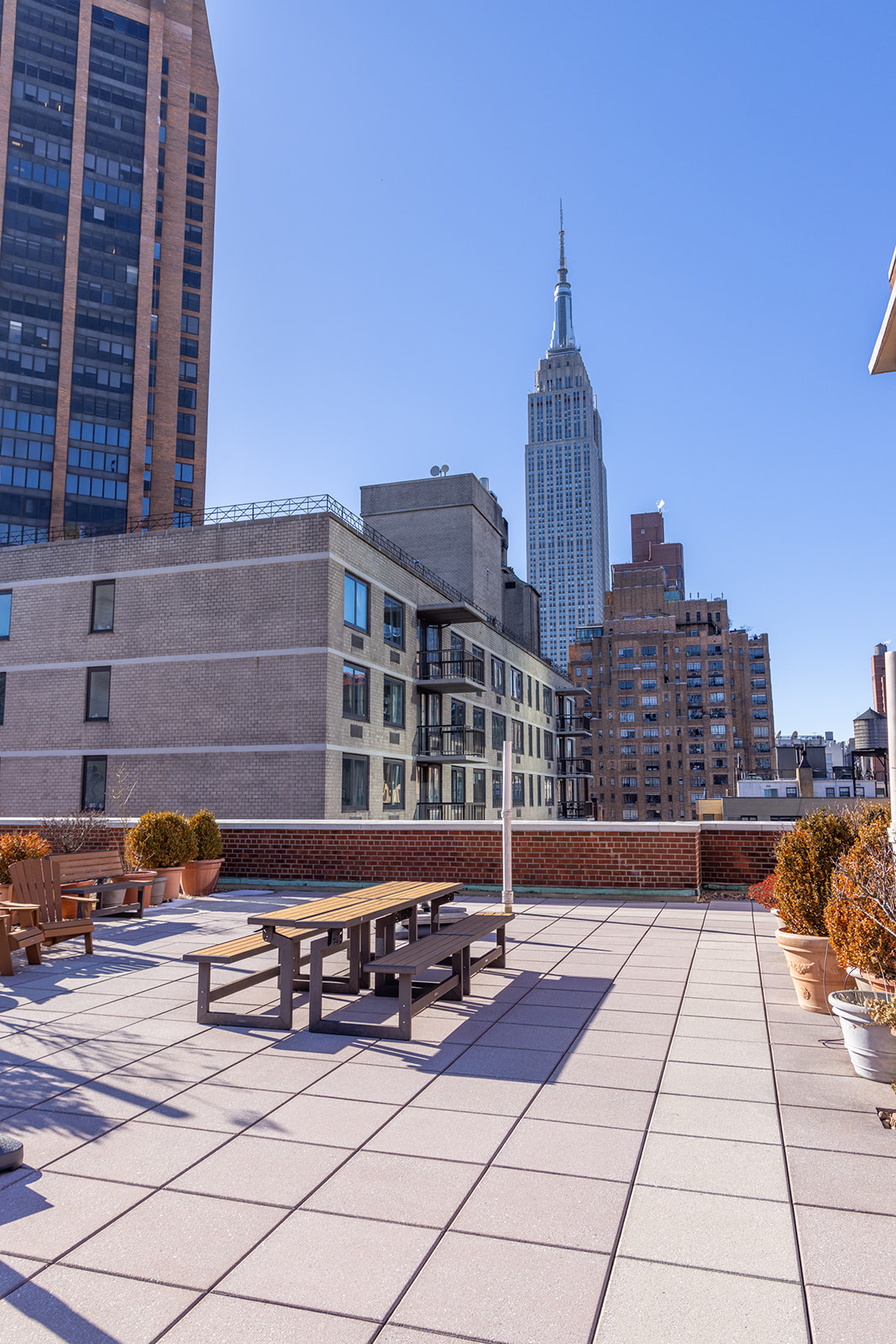132 East 35th Street, Unit 7H Manhattan, NY 10016 - Photo 21 of 25 a view of a building and bench
