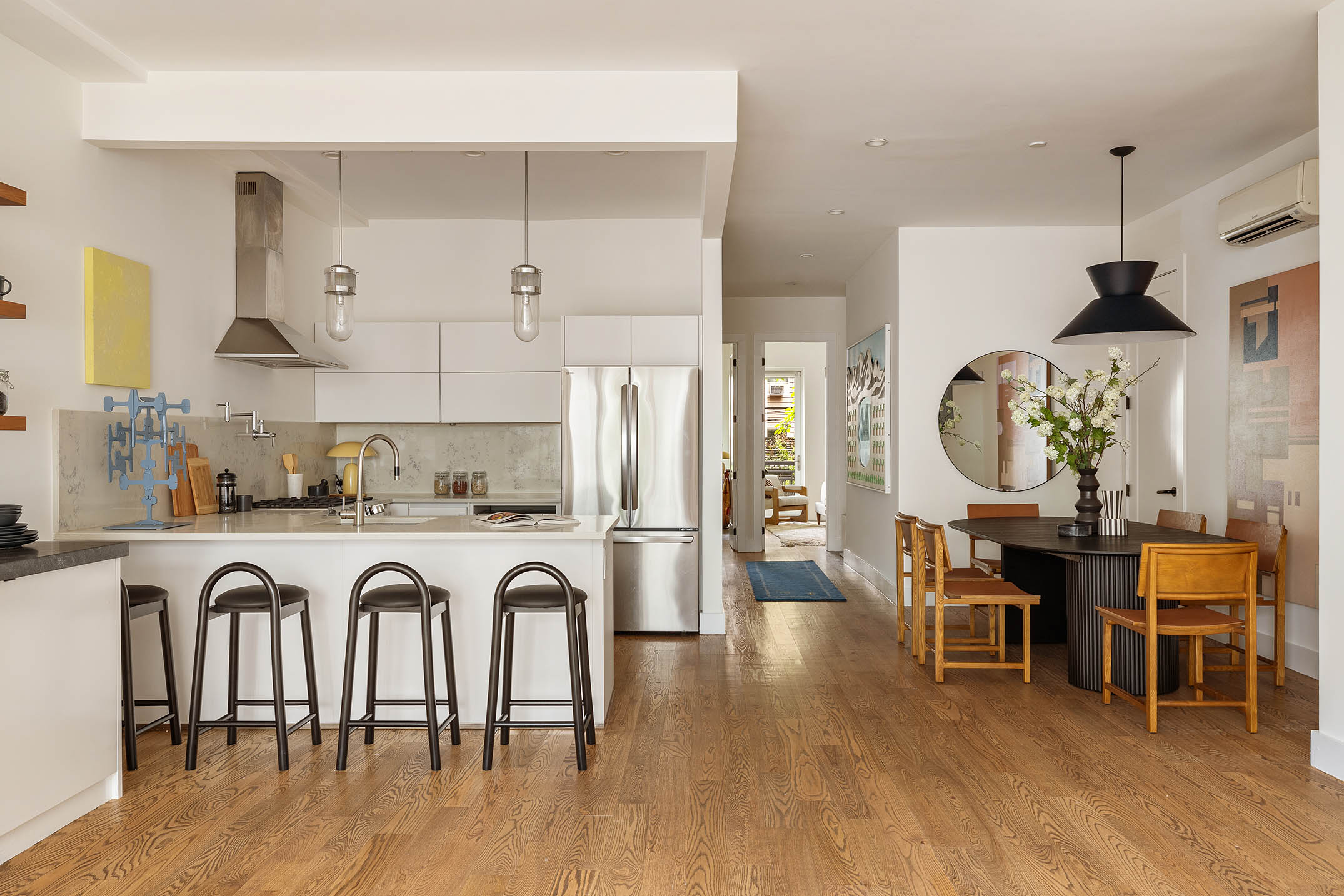 1025 Lorimer Street, Unit PARLOR Brooklyn, NY 11222 - Photo 6 of 21 a view of a kitchen with dining table and stainless steel appliances