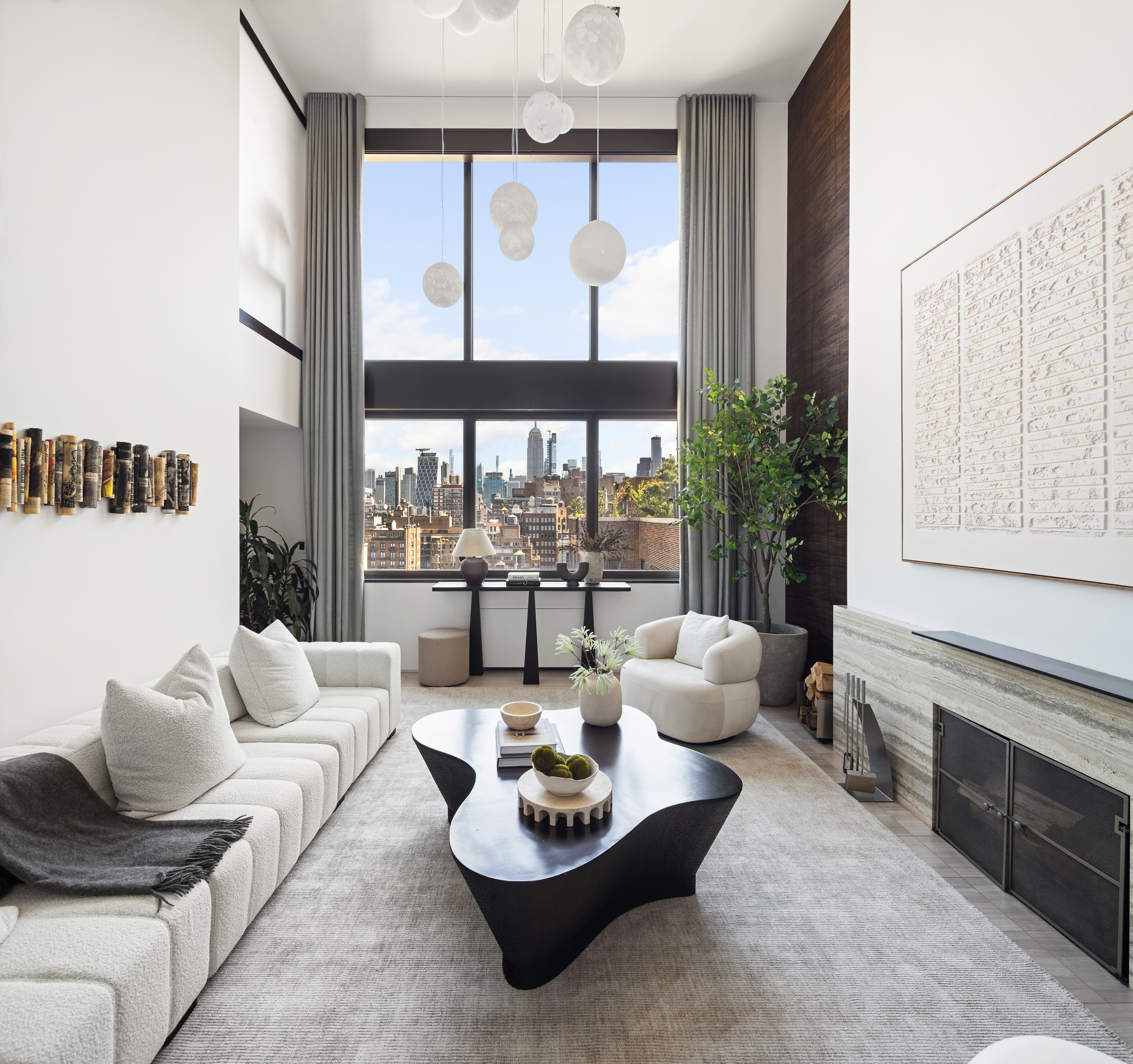 24 5th Avenue, Unit PH1701 Manhattan, NY 10011 - Photo 4 of 24 a living room with furniture and a large window