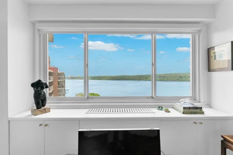 a view of a kitchen with a sink and cabinets
