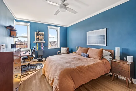 a bedroom with bed and a cabinets