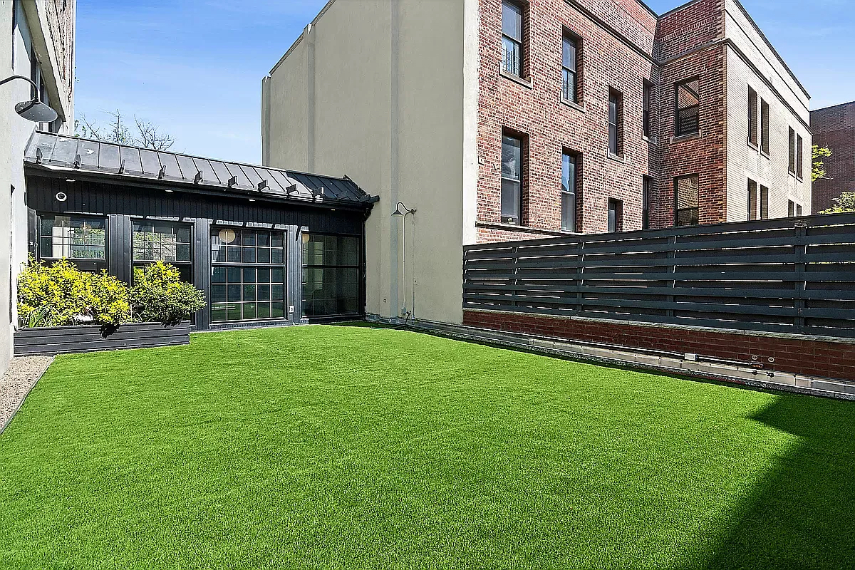 180 Bainbridge Street, Unit 109 Brooklyn, NY 11233 - Photo 9 of 20 a view of a house with a garden