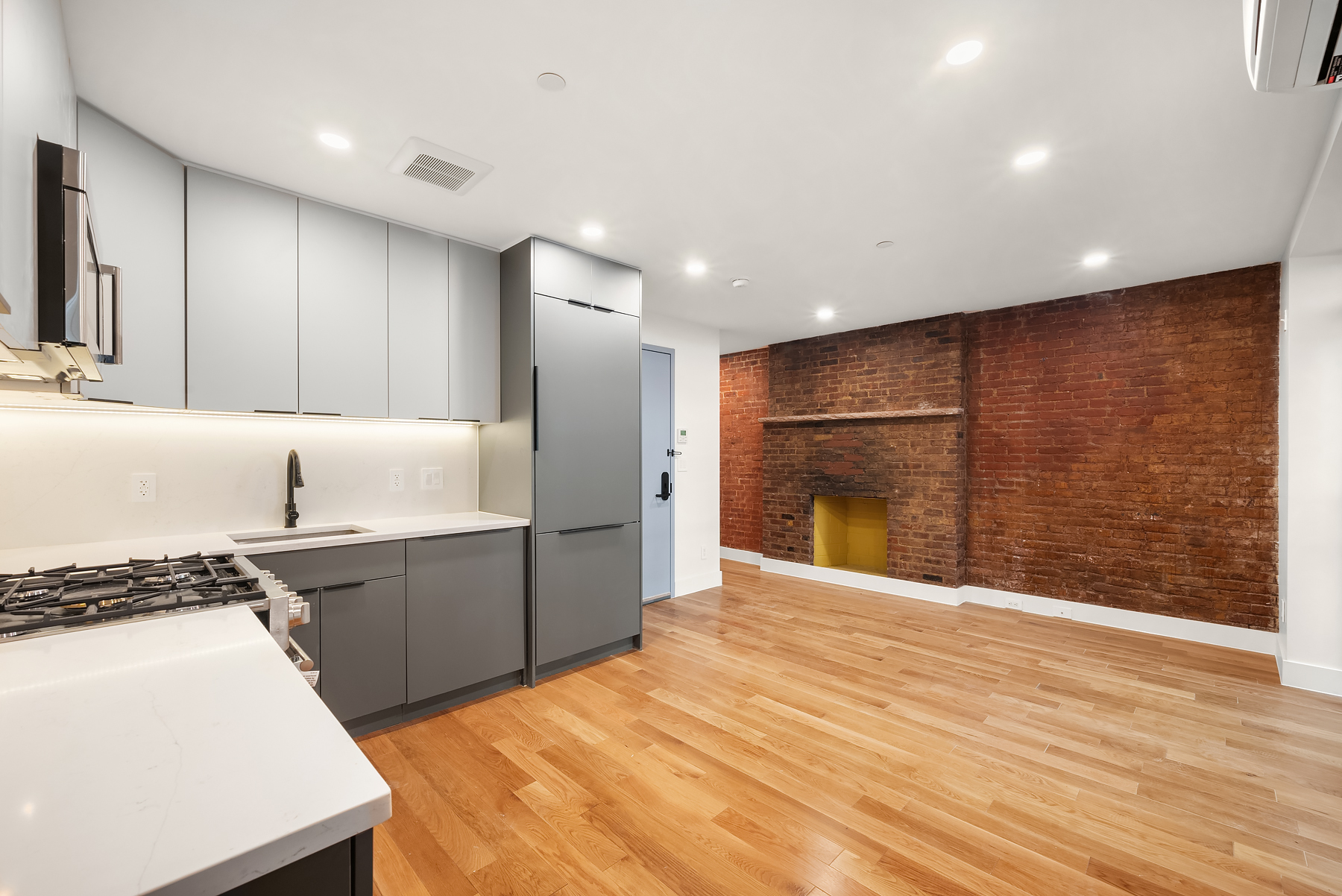 61 West 70th Street, Unit 1A Manhattan, NY 10023 - Photo 2 of 15 a kitchen with granite countertop cabinets and steel stainless steel appliances