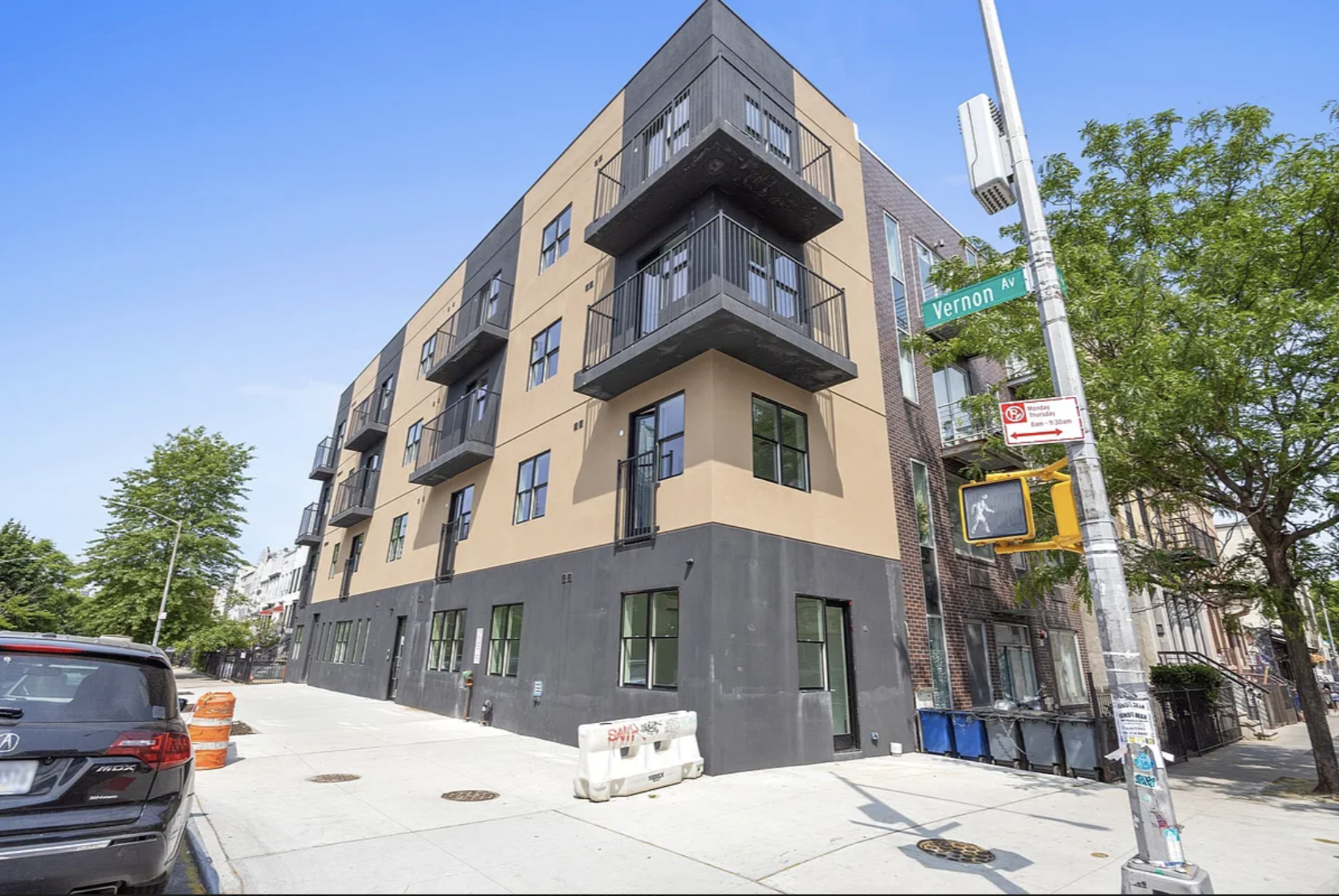586 Marcy Avenue, Unit 3A Brooklyn, NY 11206 - Photo 7 of 7 a view of a white building among the street