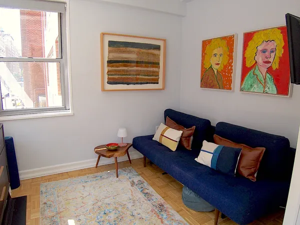 a living room with furniture and a window