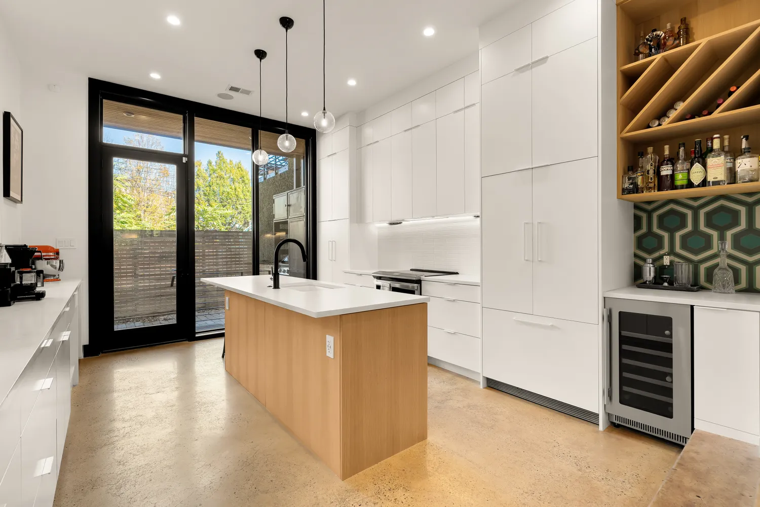 a kitchen with stainless steel appliances granite countertop a stove and a sink