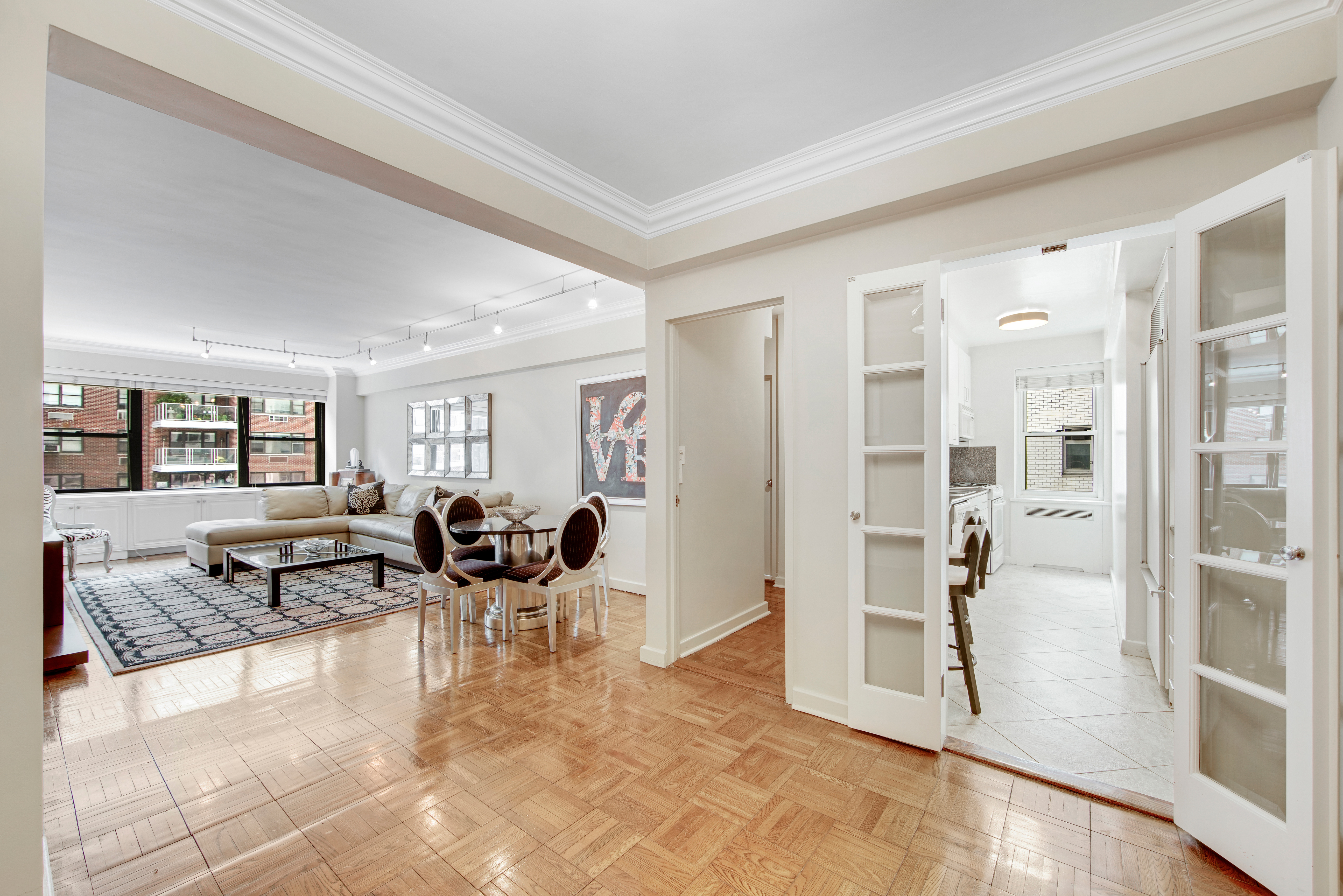 a living room with fireplace furniture and floor to ceiling window