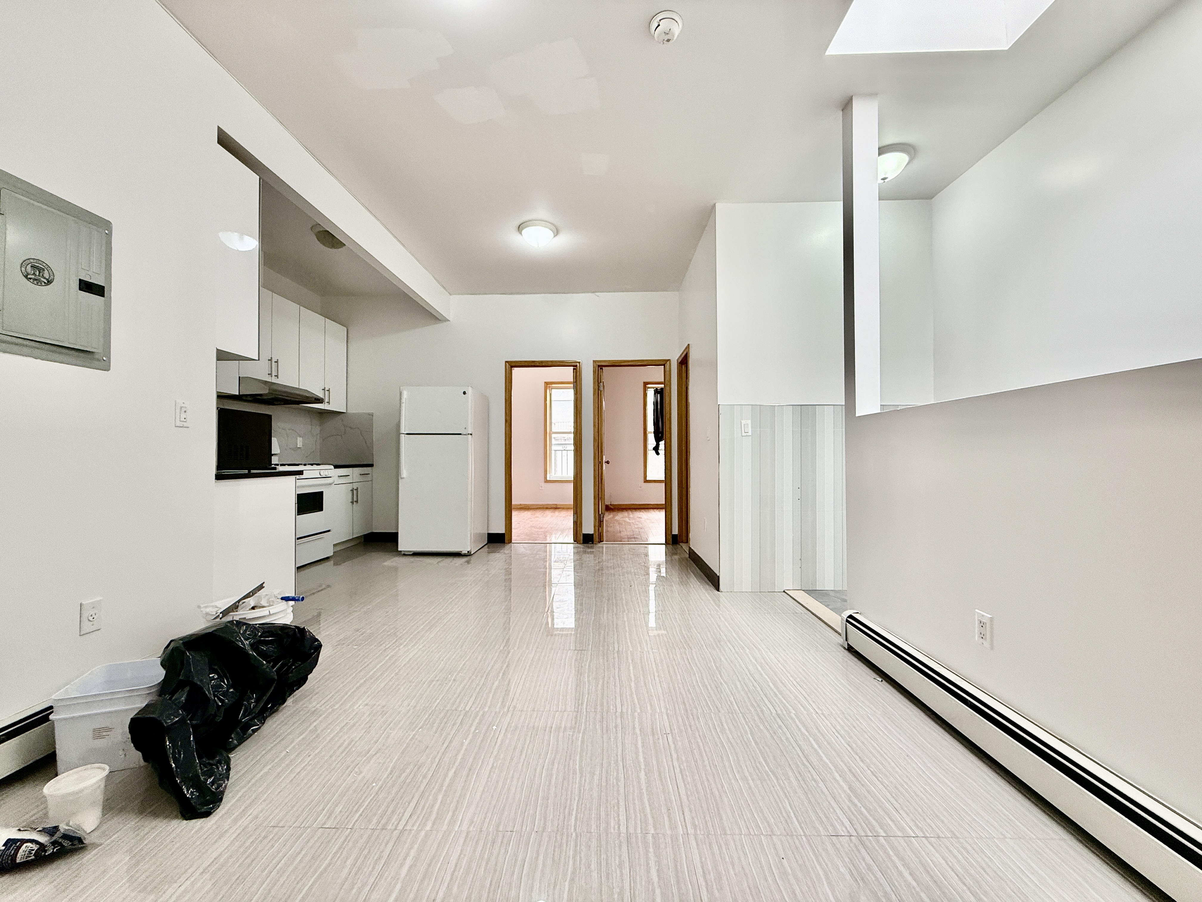 543 53rd Street, Unit 1 Brooklyn, NY 11220 - Photo 5 of 8 a living room with furniture and a flat screen tv