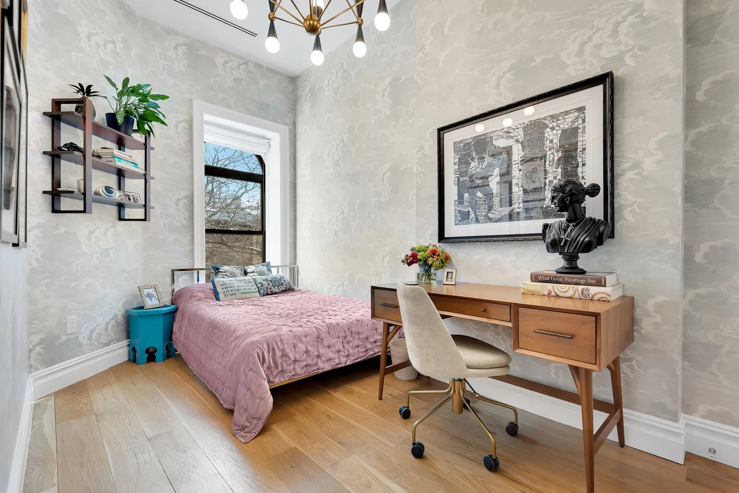 a bedroom with a bed and a table