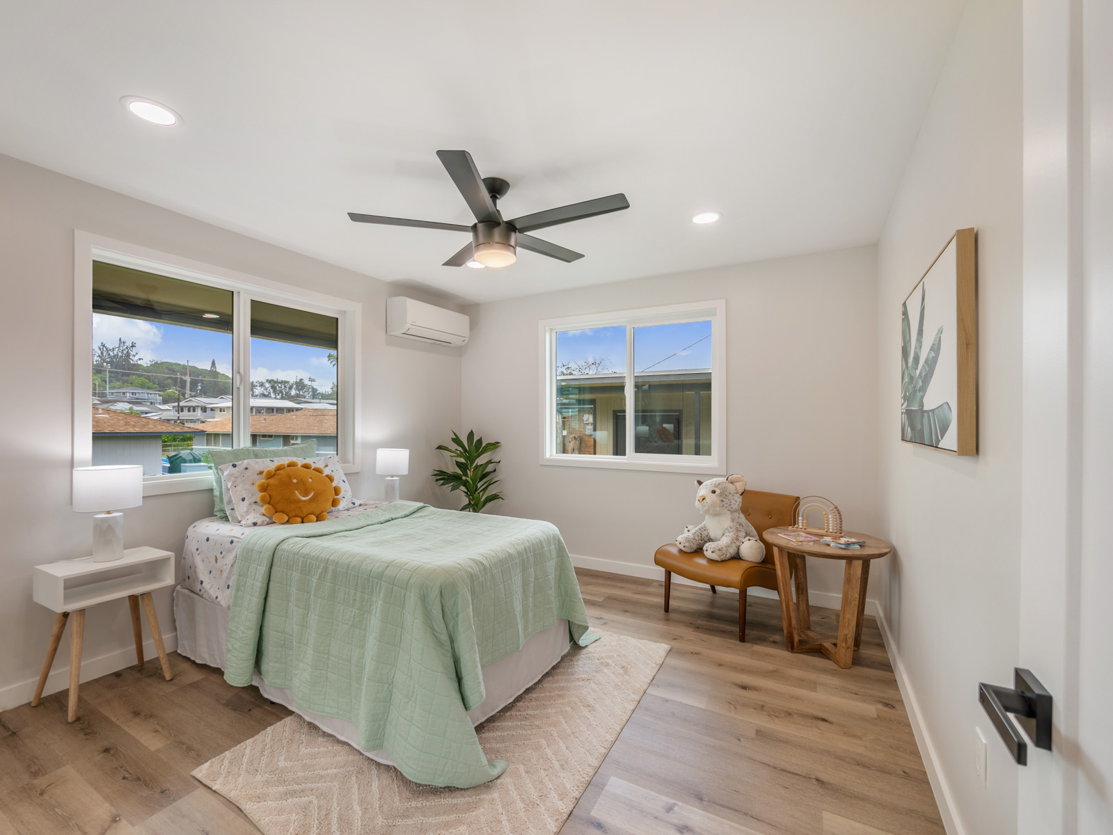 45-561 Paleka Road, Unit C Kaneohe, HI 96744 - Photo 16 of 27 a bedroom with a bed and wooden floor