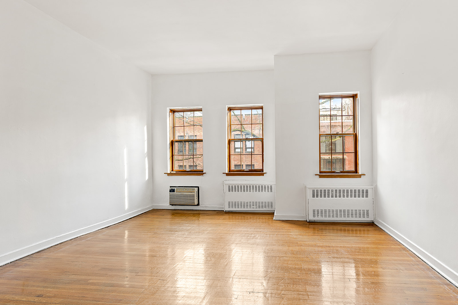 127 West 95th Street Manhattan, NY 10025 - Photo 9 of 15 an empty room with windows