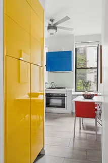 a kitchen with stainless steel appliances a stove a sink and a refrigerator
