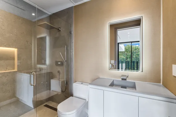 a bathroom with a sink toilet and shower