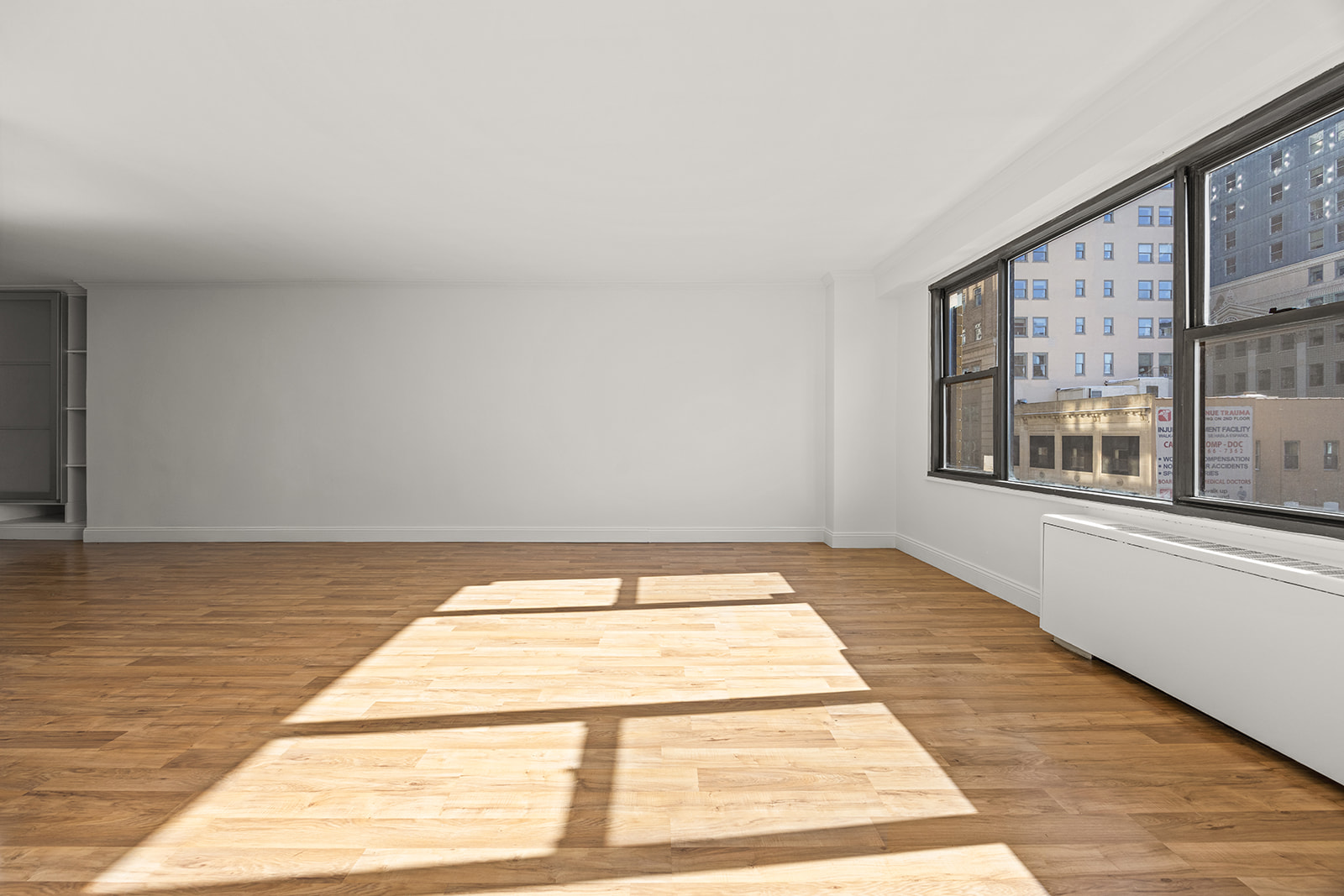 85 Livingston Street, Unit 6F Brooklyn, NY 11201 - Photo 6 of 11 a view of an empty room with window and wooden floor