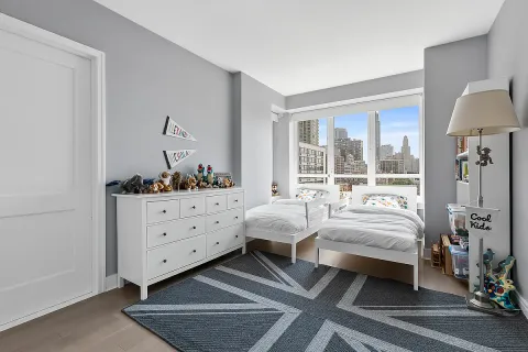 a bed room with furniture and a window