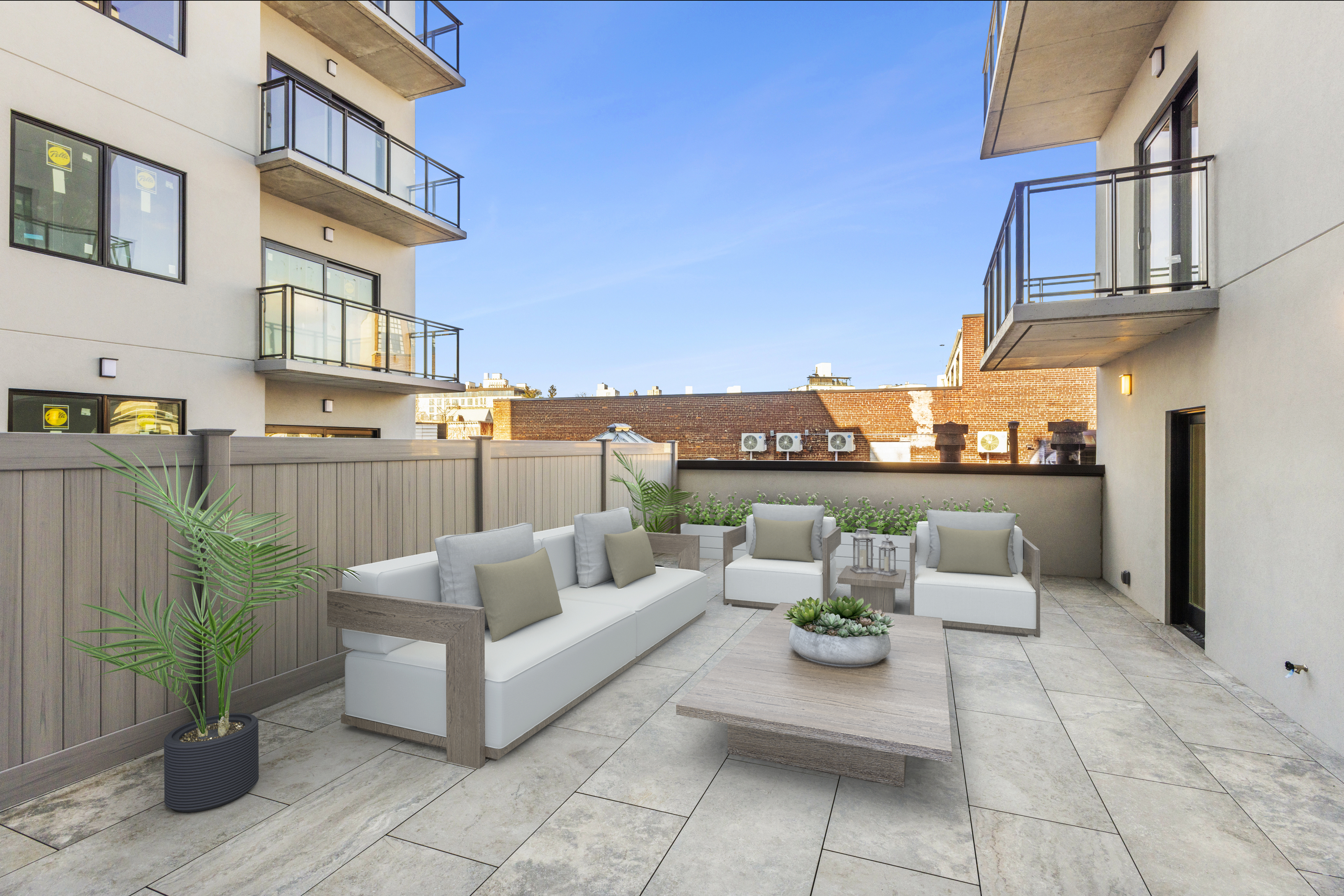 12-16 30th Avenue, Unit 303 Queens, NY 11102 - Photo 10 of 18 a view of a patio with couches and potted plants