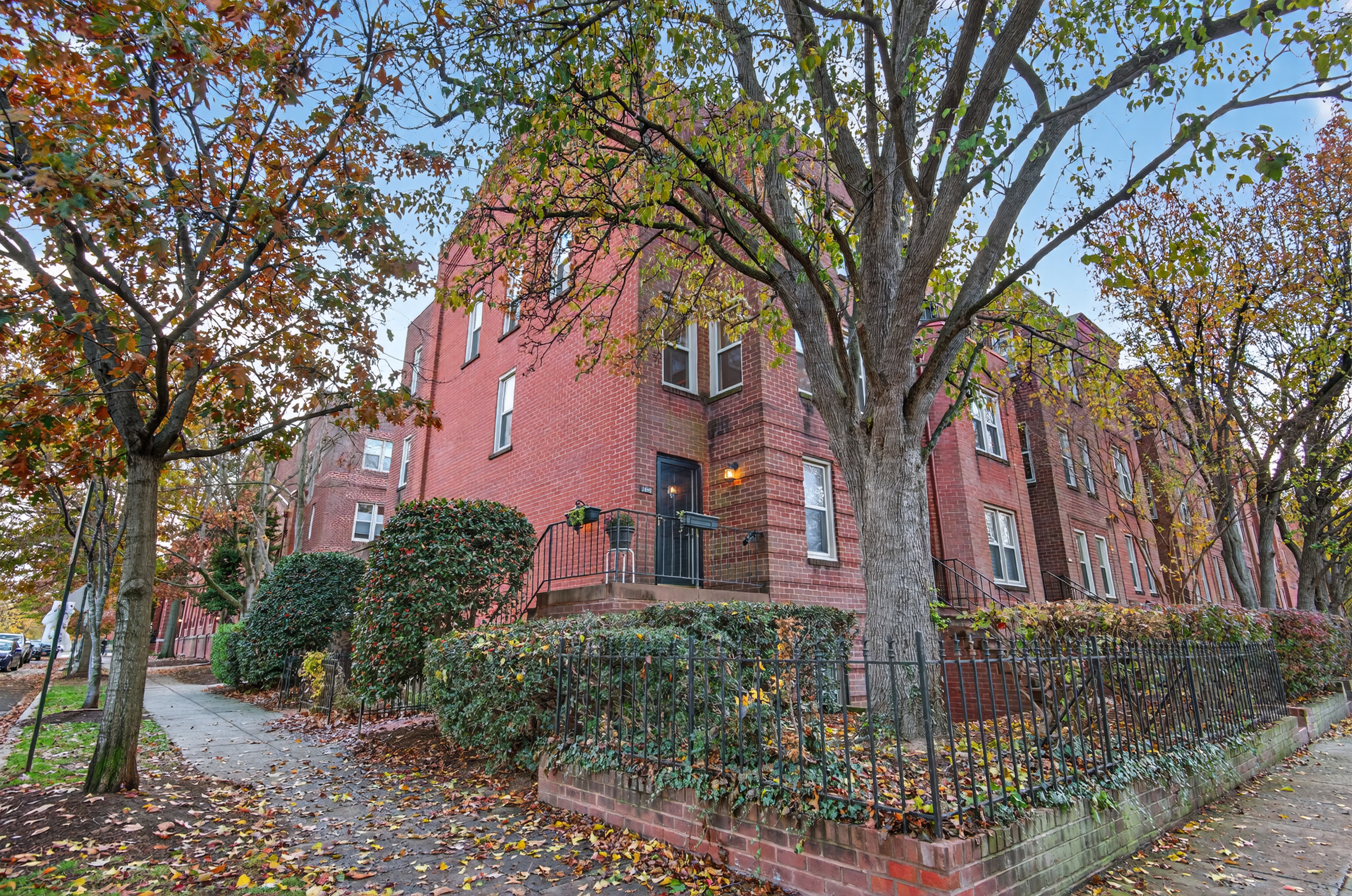 1493 15th Street Northeast, Unit 1493 Washington, DC 20002 - Photo 1 of 26 a brick building with trees in front of it