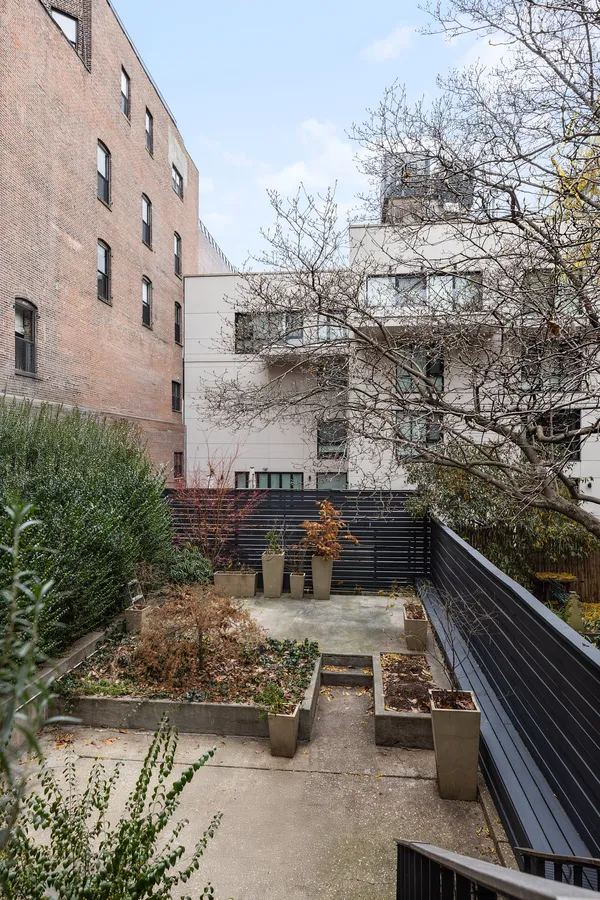 front view of a house with a bench