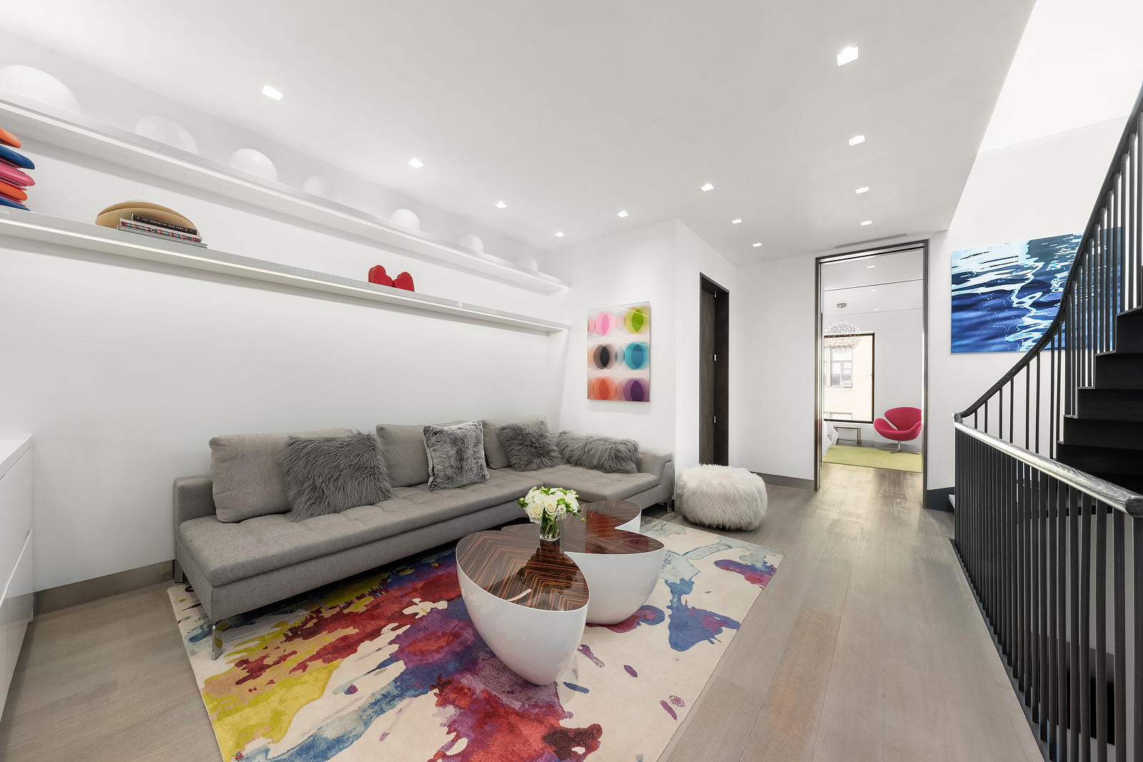 184 East 75th Street Manhattan, NY 10021 - Photo 12 of 20 a living room with furniture and a rug