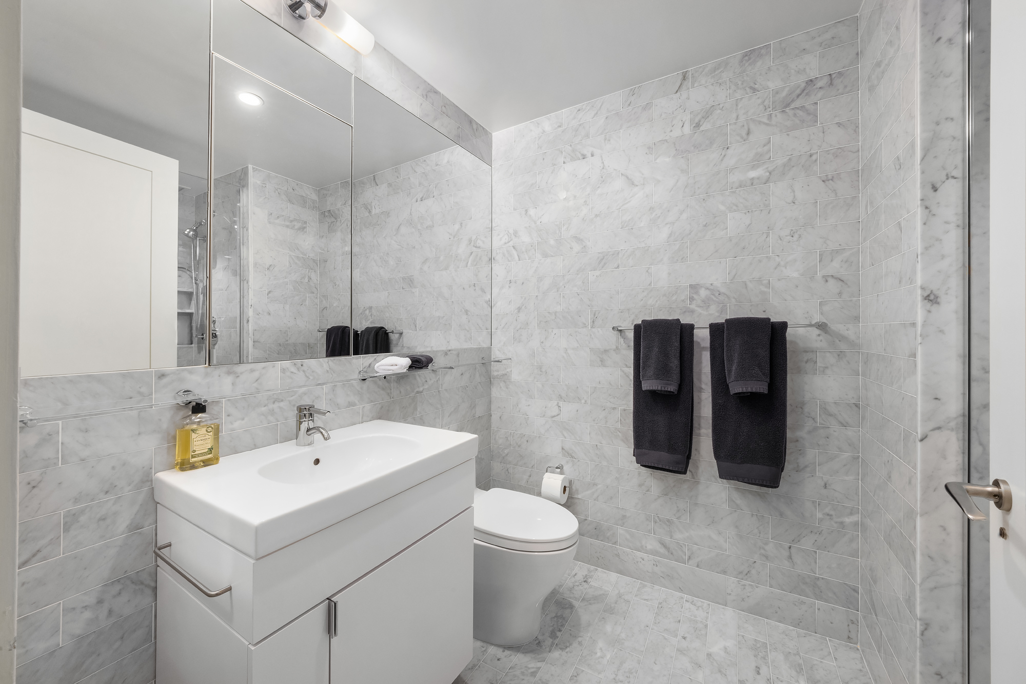 110 Central Park South, Unit 12ABC Manhattan, NY 10019 - Photo 36 of 49 a bathroom with a sink toilet and shower