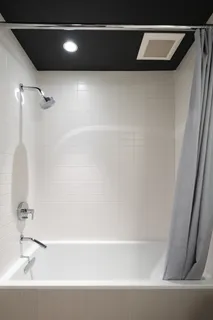 a kitchen with sink a stove and cabinets