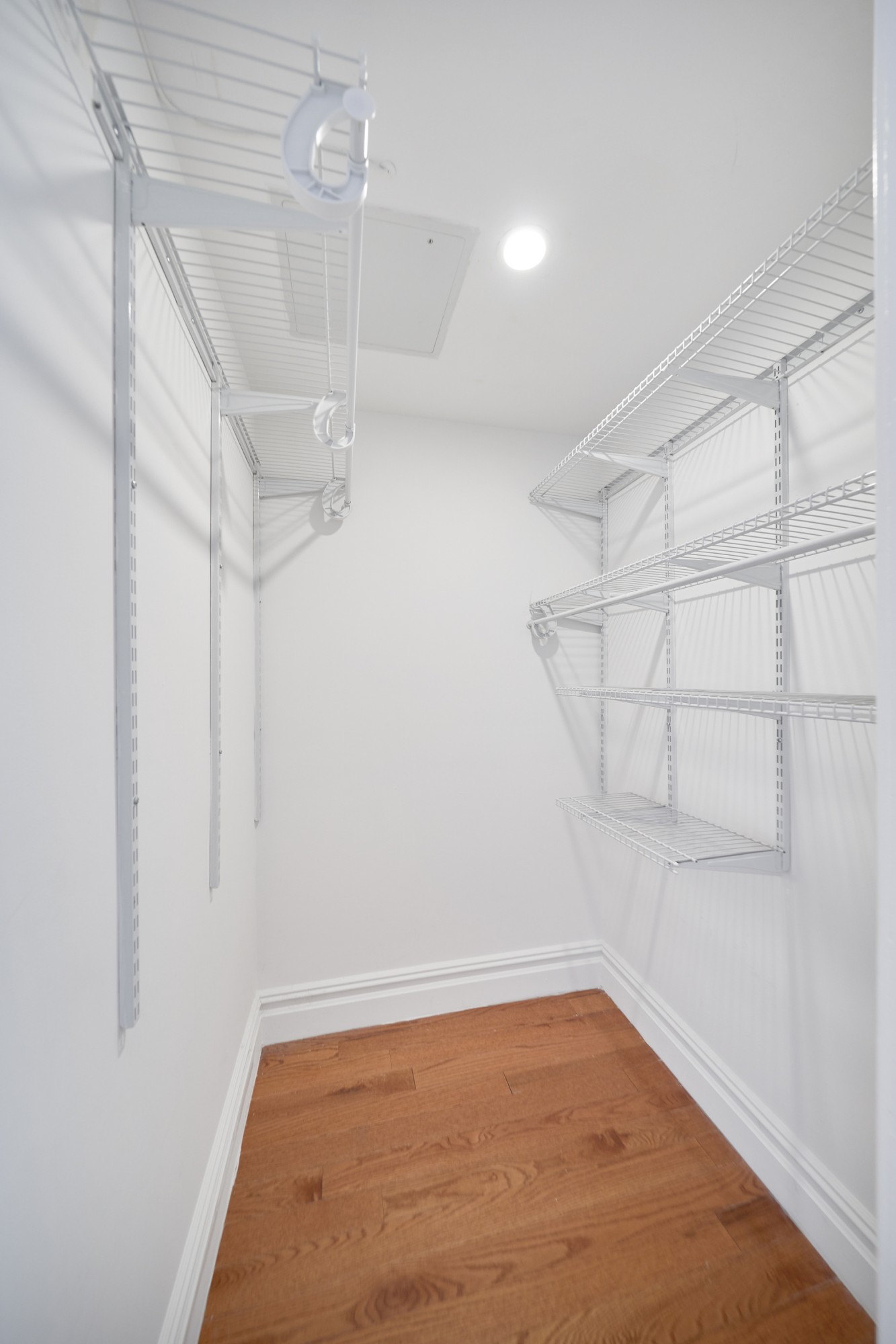 941 Columbus Avenue, Unit 1A Manhattan, NY 10025 - Photo 12 of 14 a view of a room with racks on the wall